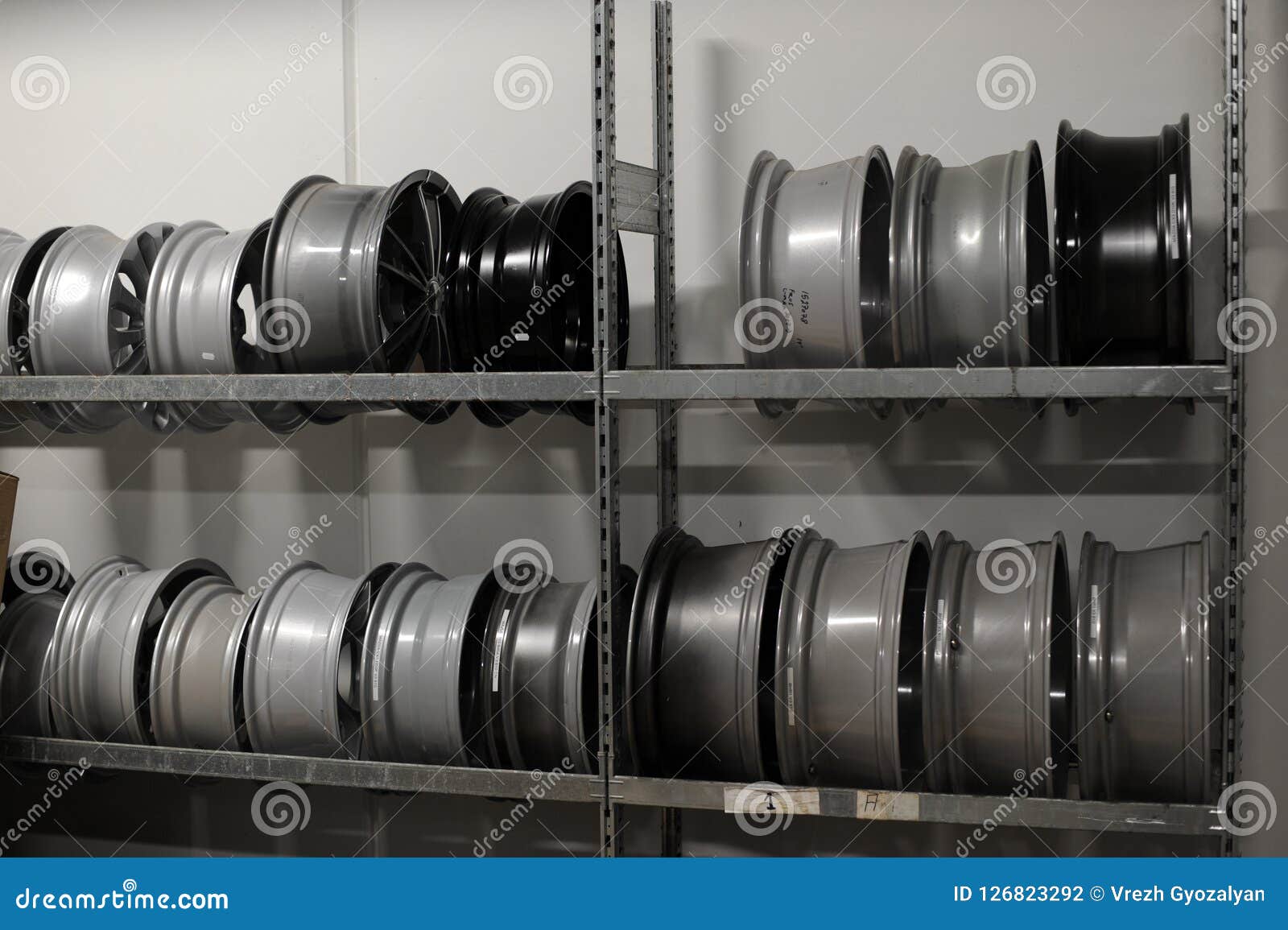 Car Tires and Wheels at Warehouse in Tire Store. Stock Photo Image of