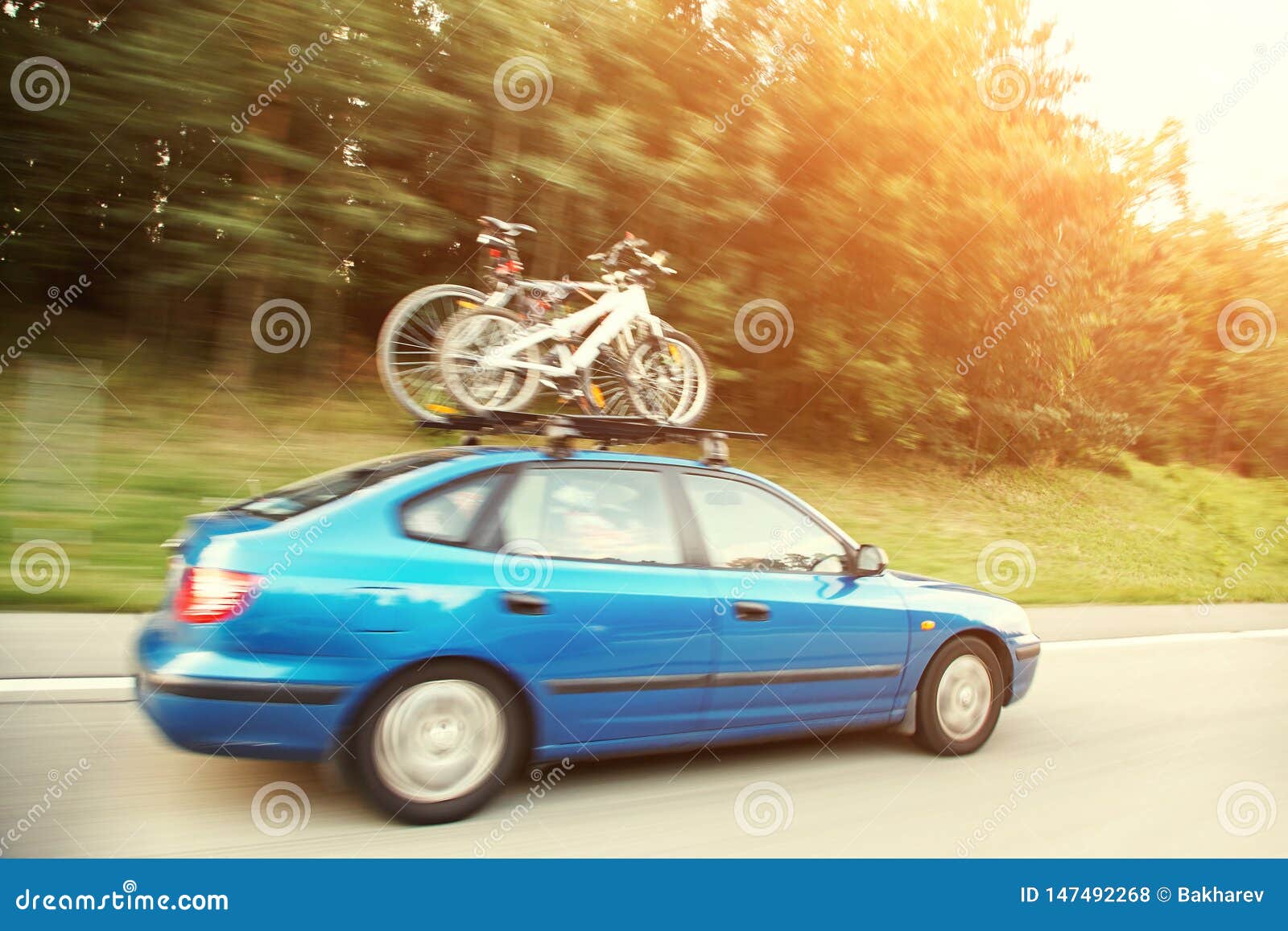 Car is Transporting Bicycles on Rack. Bikes on the Trunk. Stock Photo
