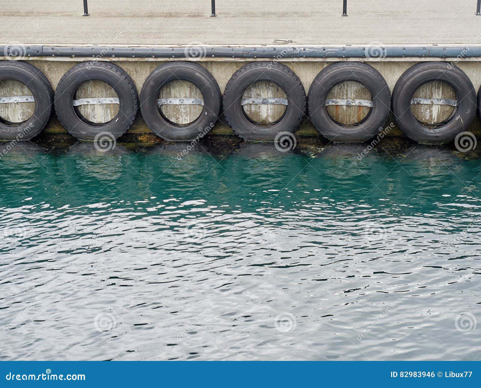 Car tyre pier bumpers stock photo. Image of river, transport 82983946