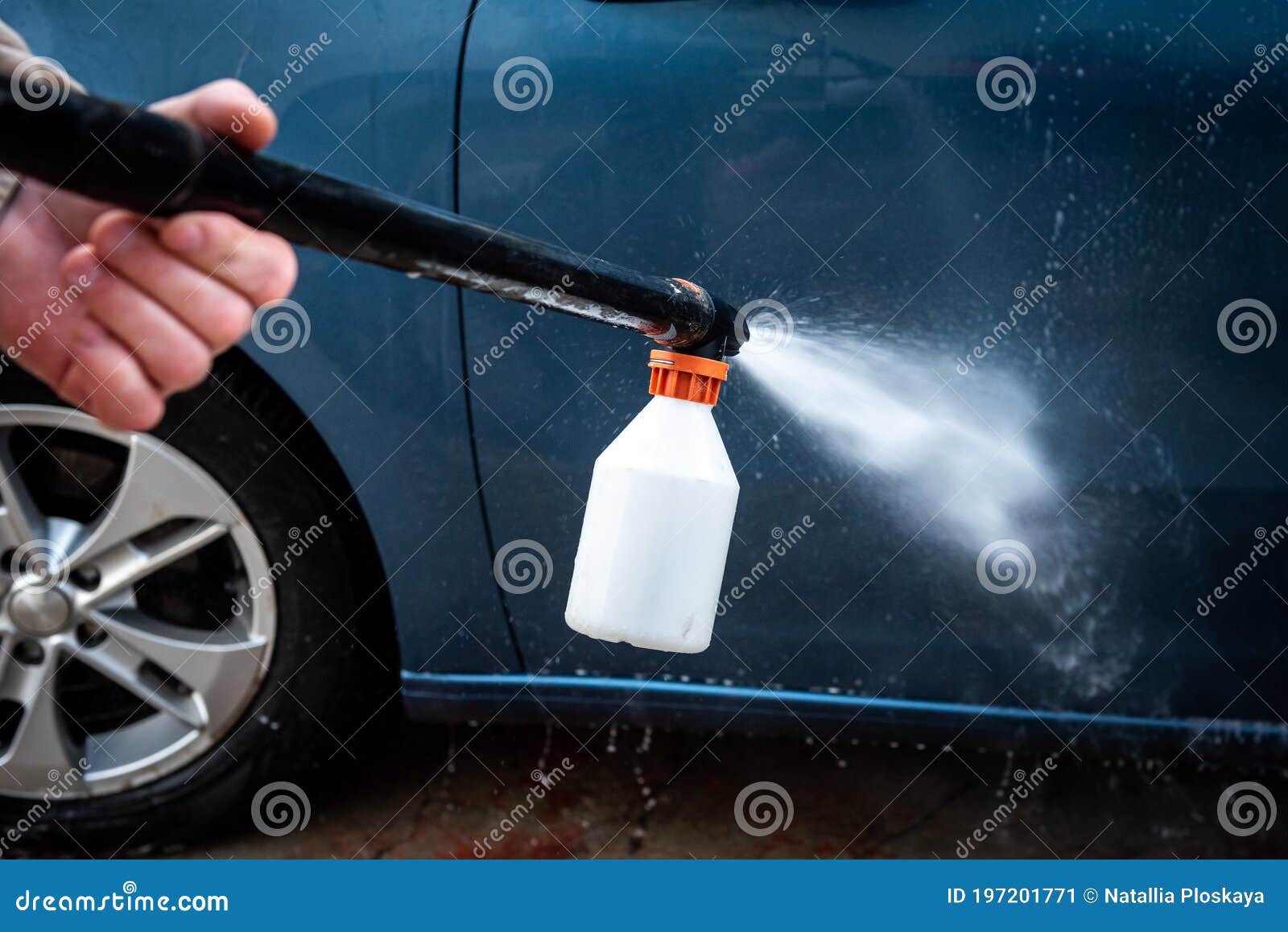 Car Wash Process. Spray Foam Bubble Shampoo on the Car Surface Stock