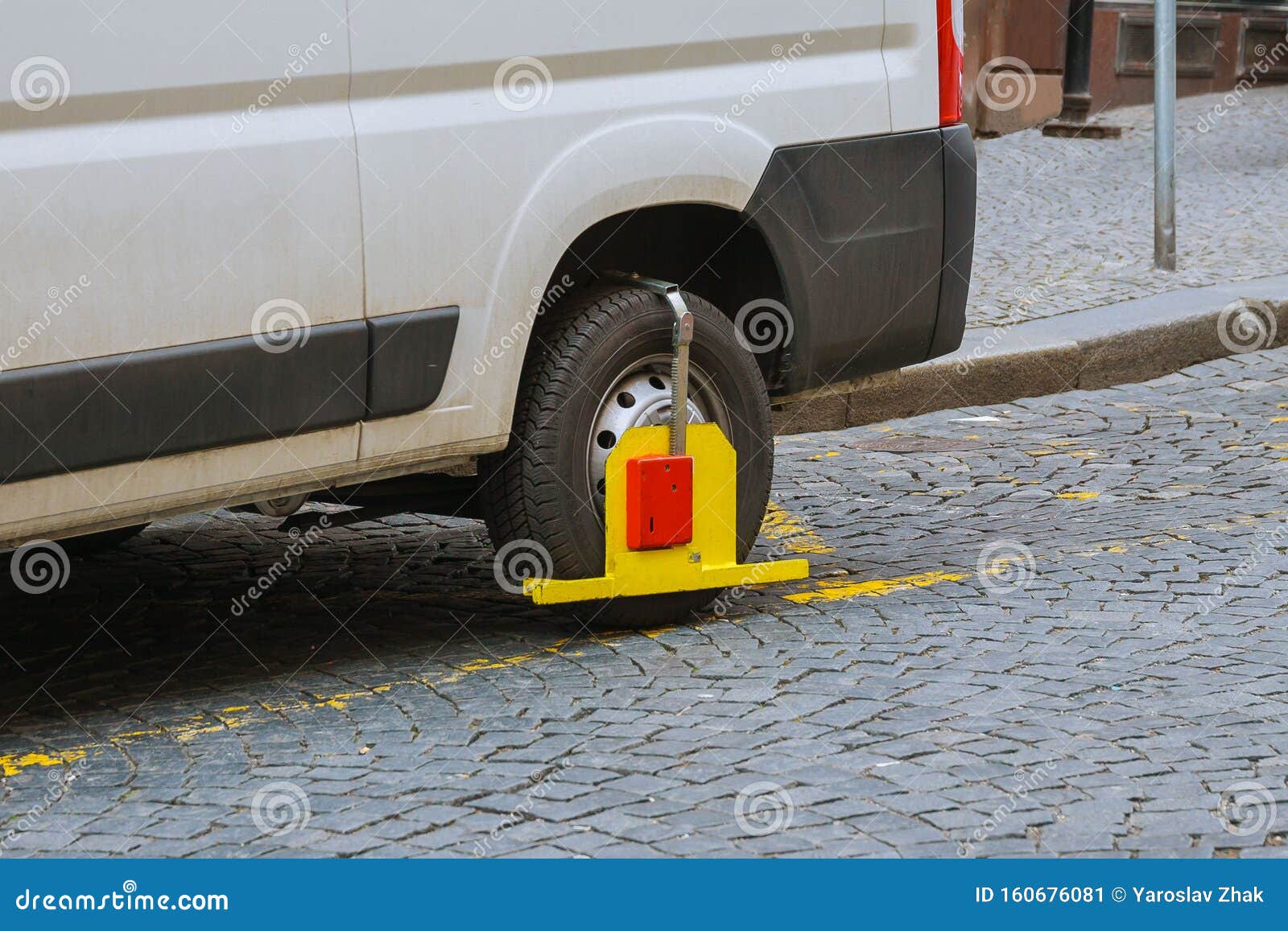 Car Wheel Blocked By Wheel Lock Because Illegal Parking Violation. Red