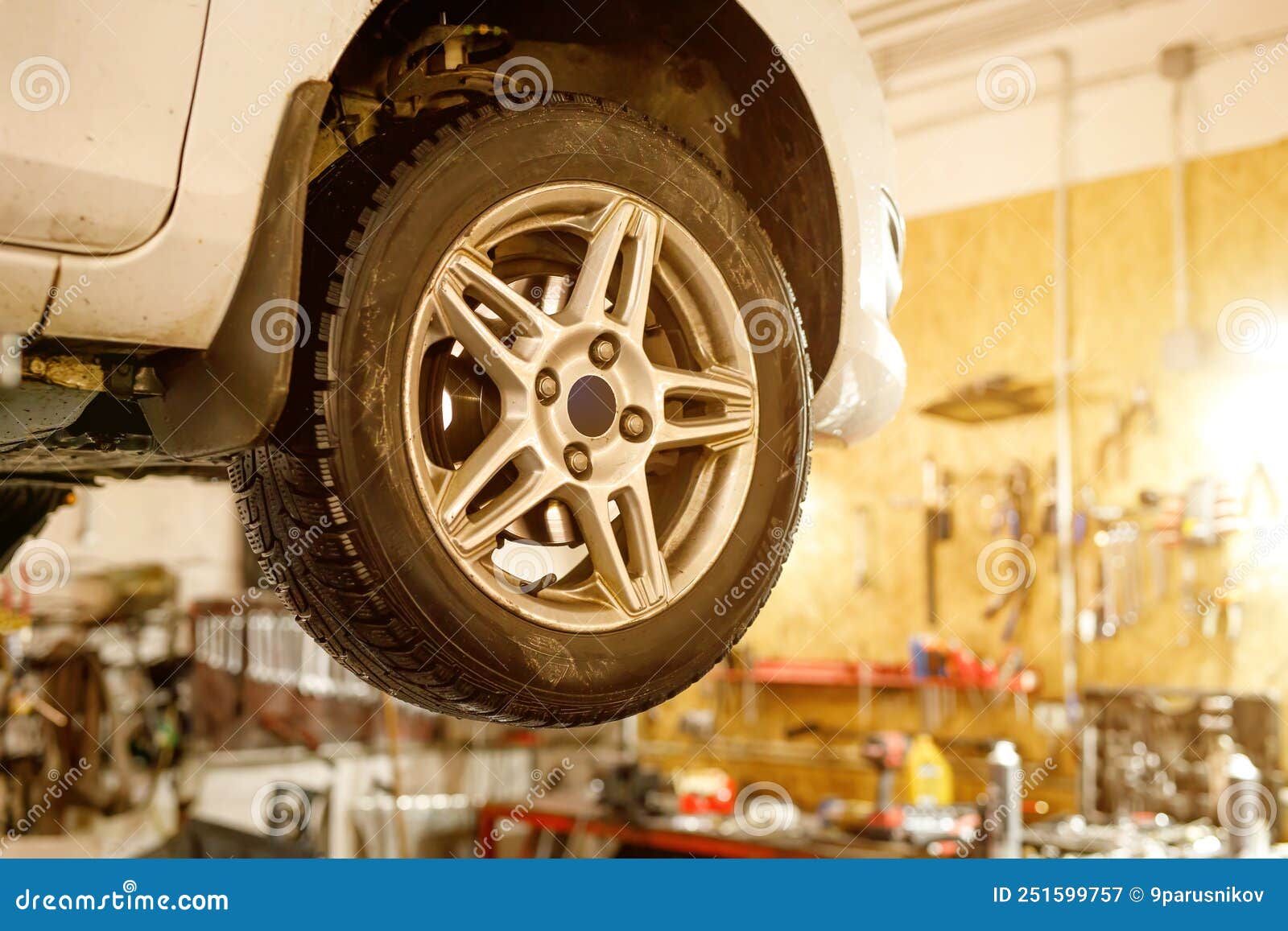 Car Wheel on a Lift in a Car Service. Stock Image Image of equipment, panel 251599757