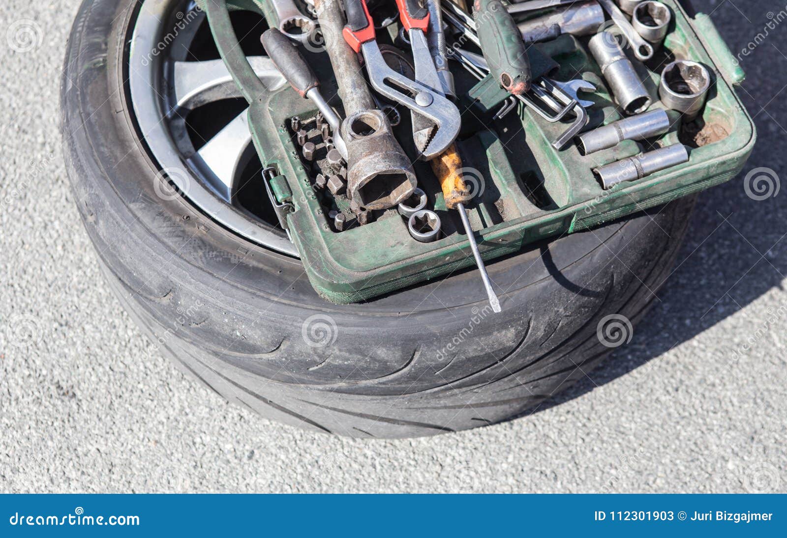Car wheel and tool box stock image. Image of automotive 112301903