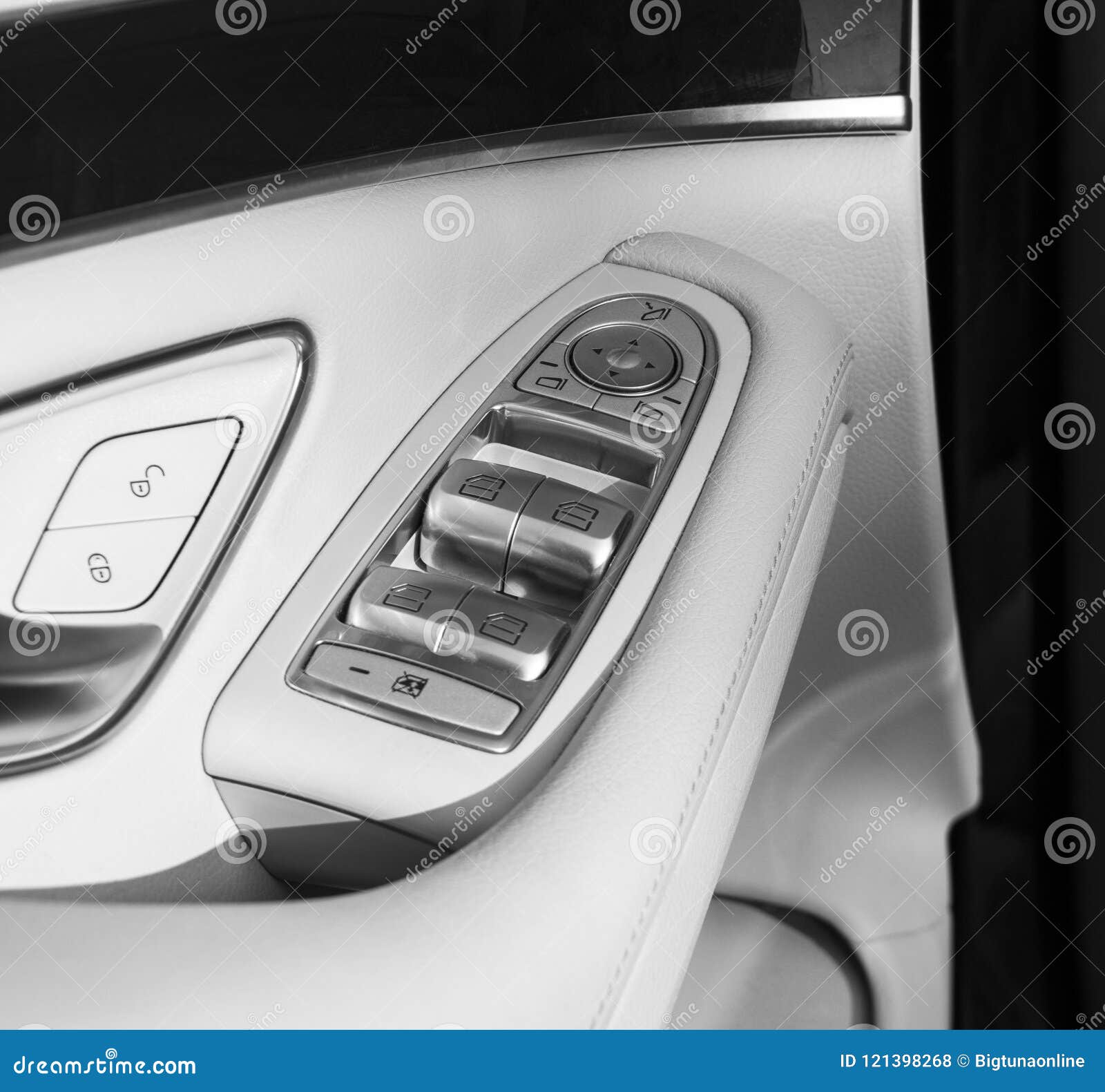 car white leather interior details of door handle with windows controls and adjustments. car window controls of modern car. car de