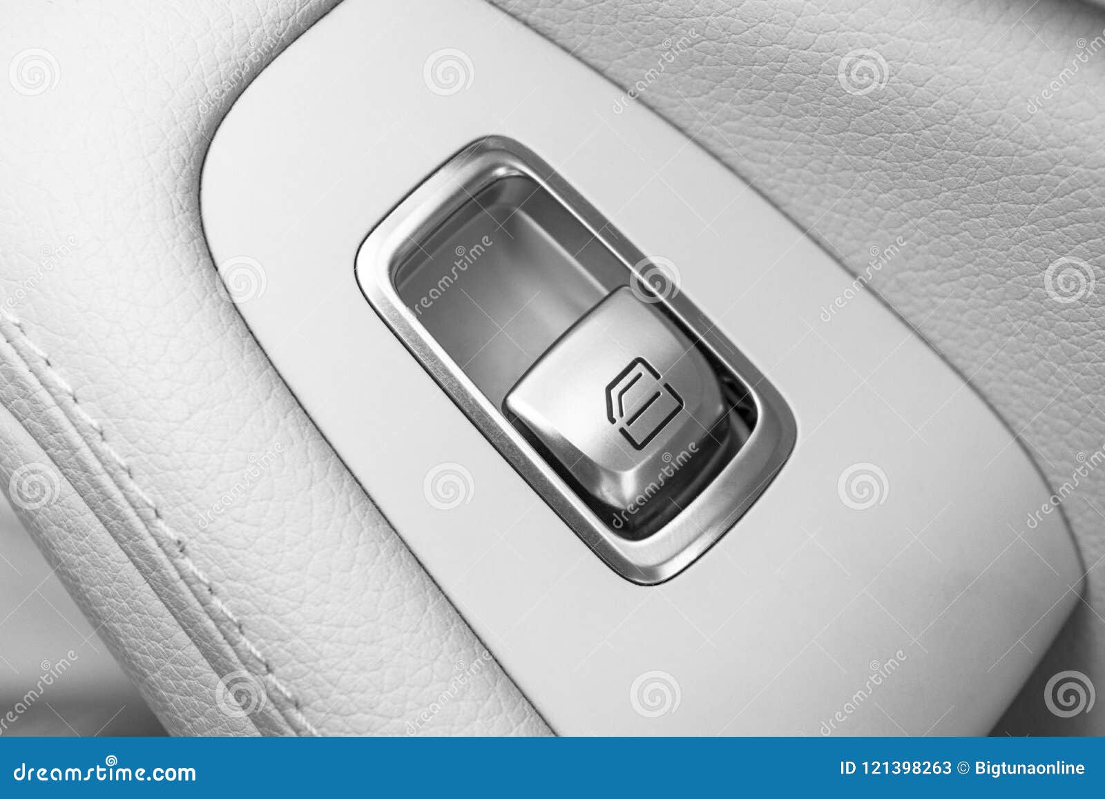 car white leather interior details of door handle with windows controls and adjustments. car window controls of modern car. car de