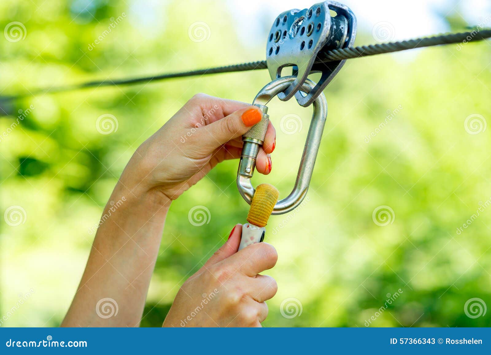Carabine on a zip line stock image. Image of safety, rope 57366343
