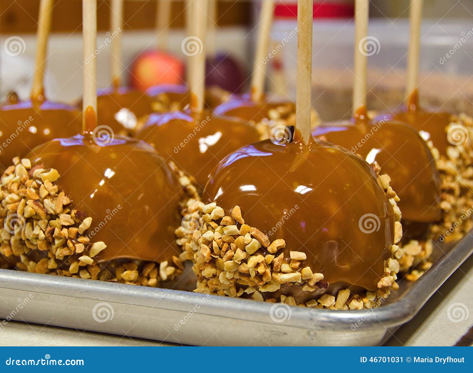 Caramel apple with nuts stock image. Image of wooden 46701031