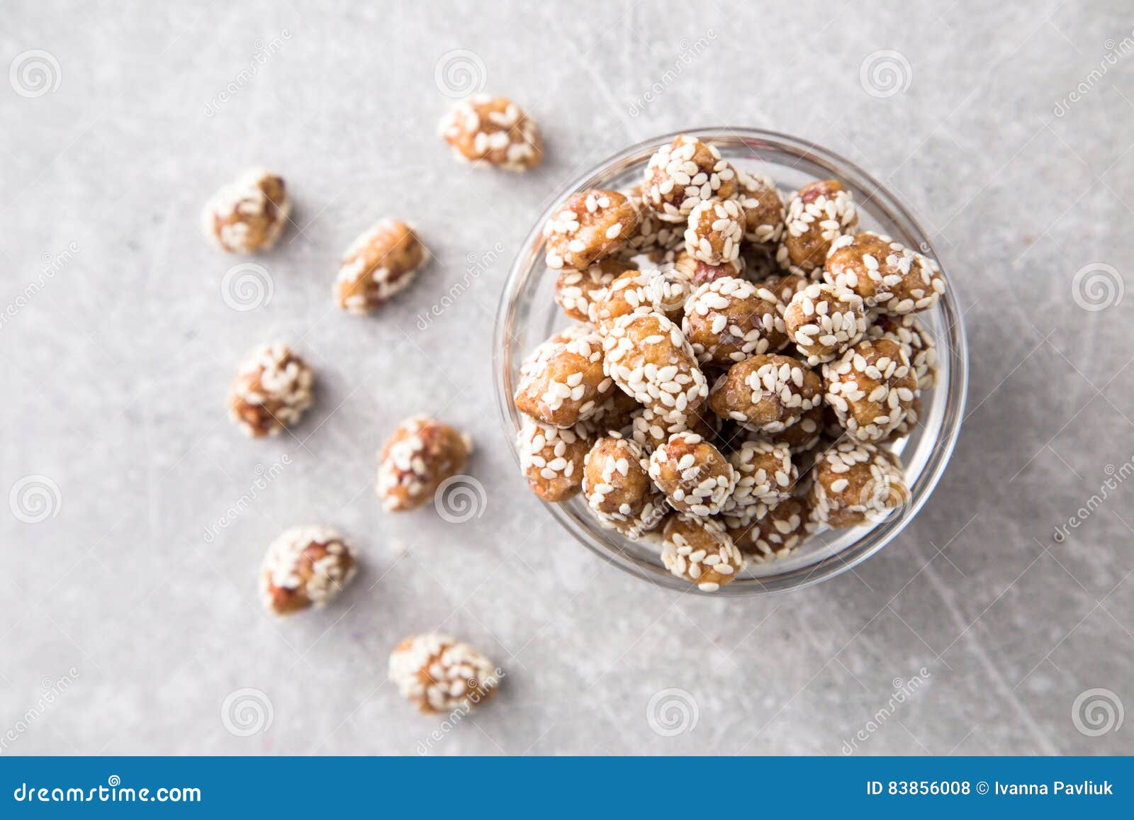Caramel Coated Peanut with Sesame on Stone Background Stock Photo