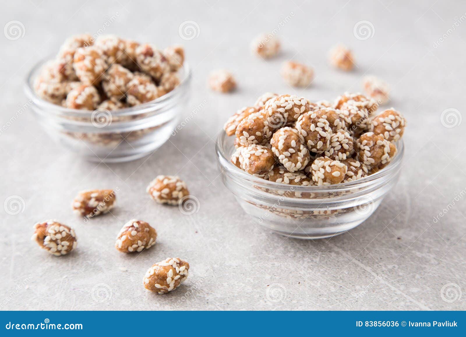 Caramel Coated Peanut with Sesame on Stone Background Stock Photo