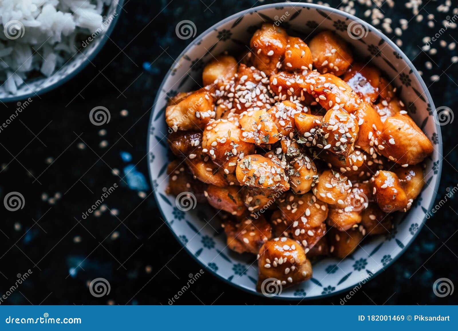 Caramelized Teriyaki Chicken with Sesame Seeds in a Bowl Stock Image