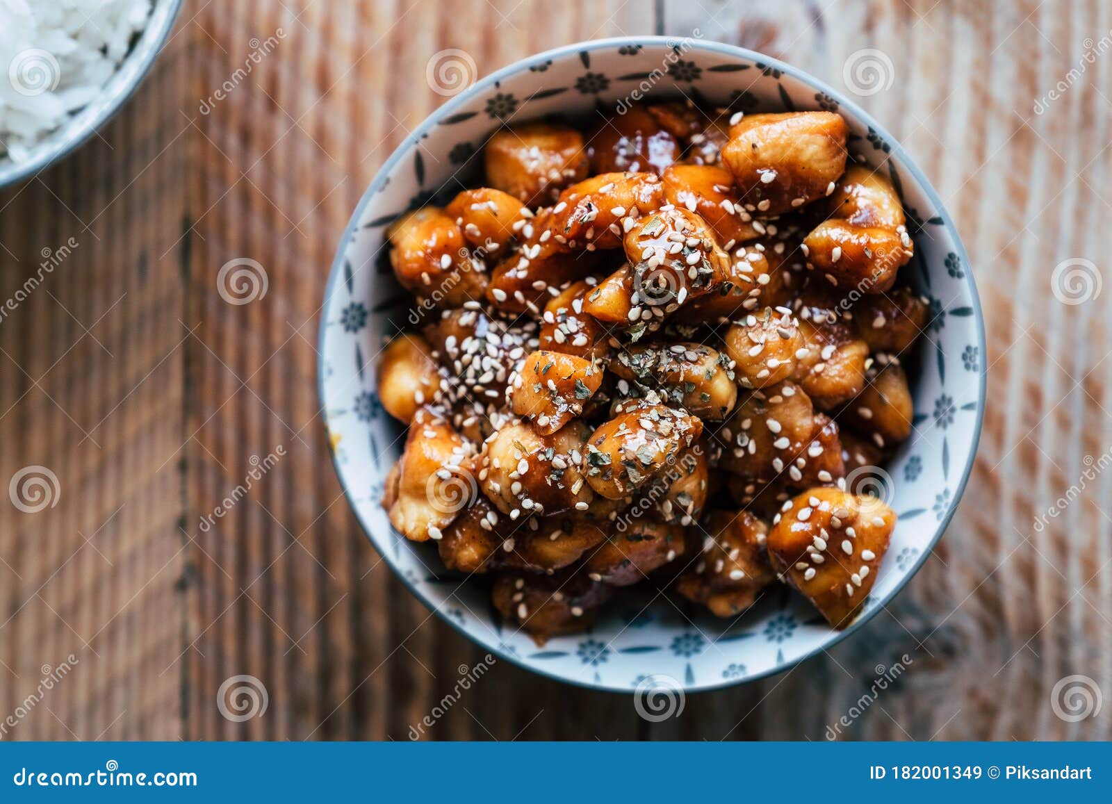 Caramelized Teriyaki Chicken with Sesame Seeds in a Bowl Stock Image ...