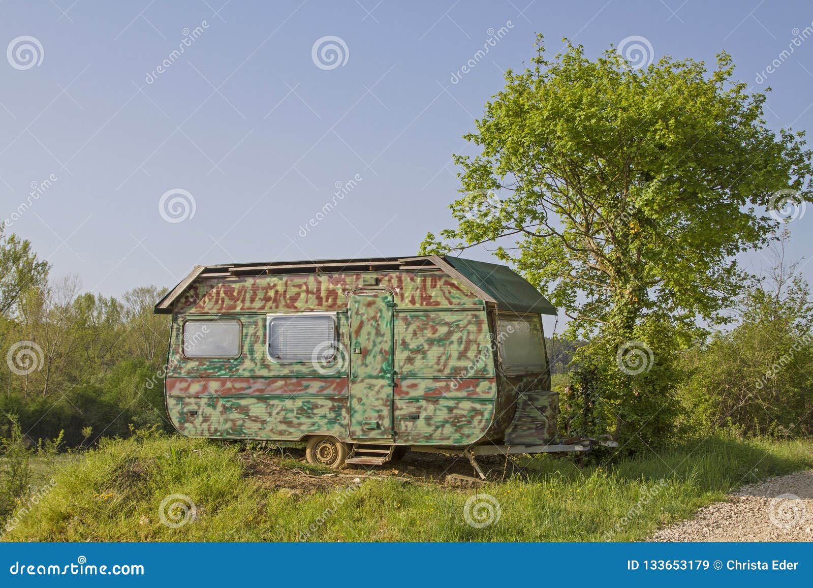 Caravan in camouflage look stock image. Image of wilderness - 133653179