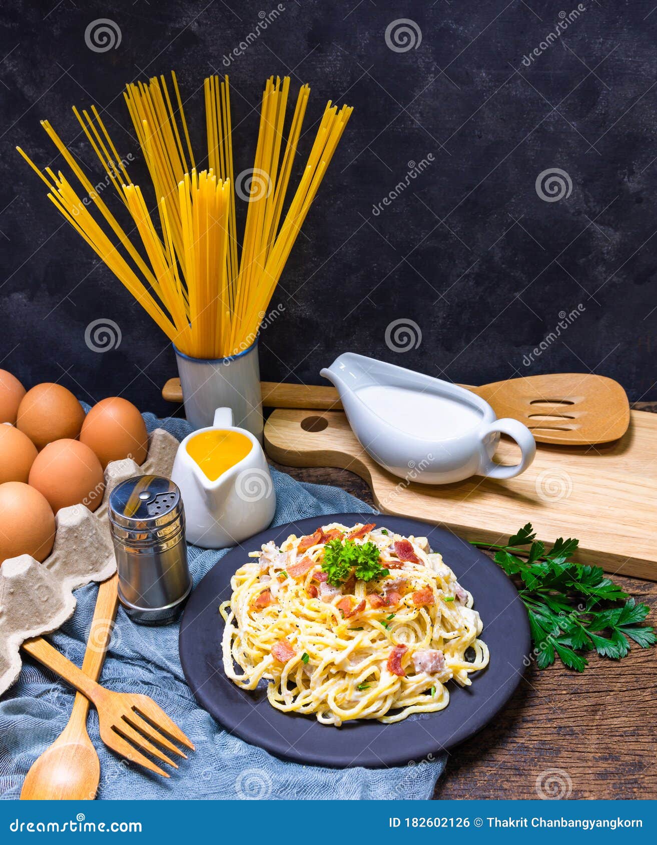 carbonara spaghetti with ingredients and tools