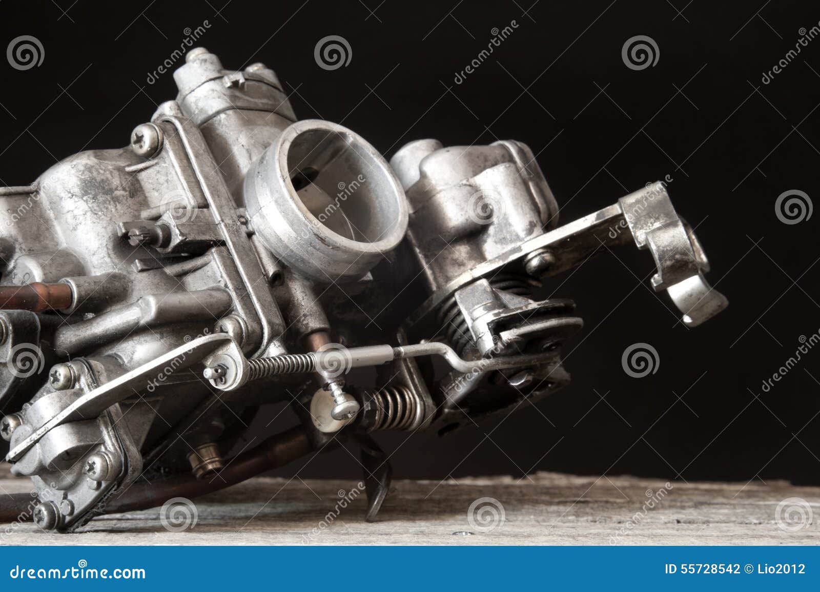 carburetor on wooden surface