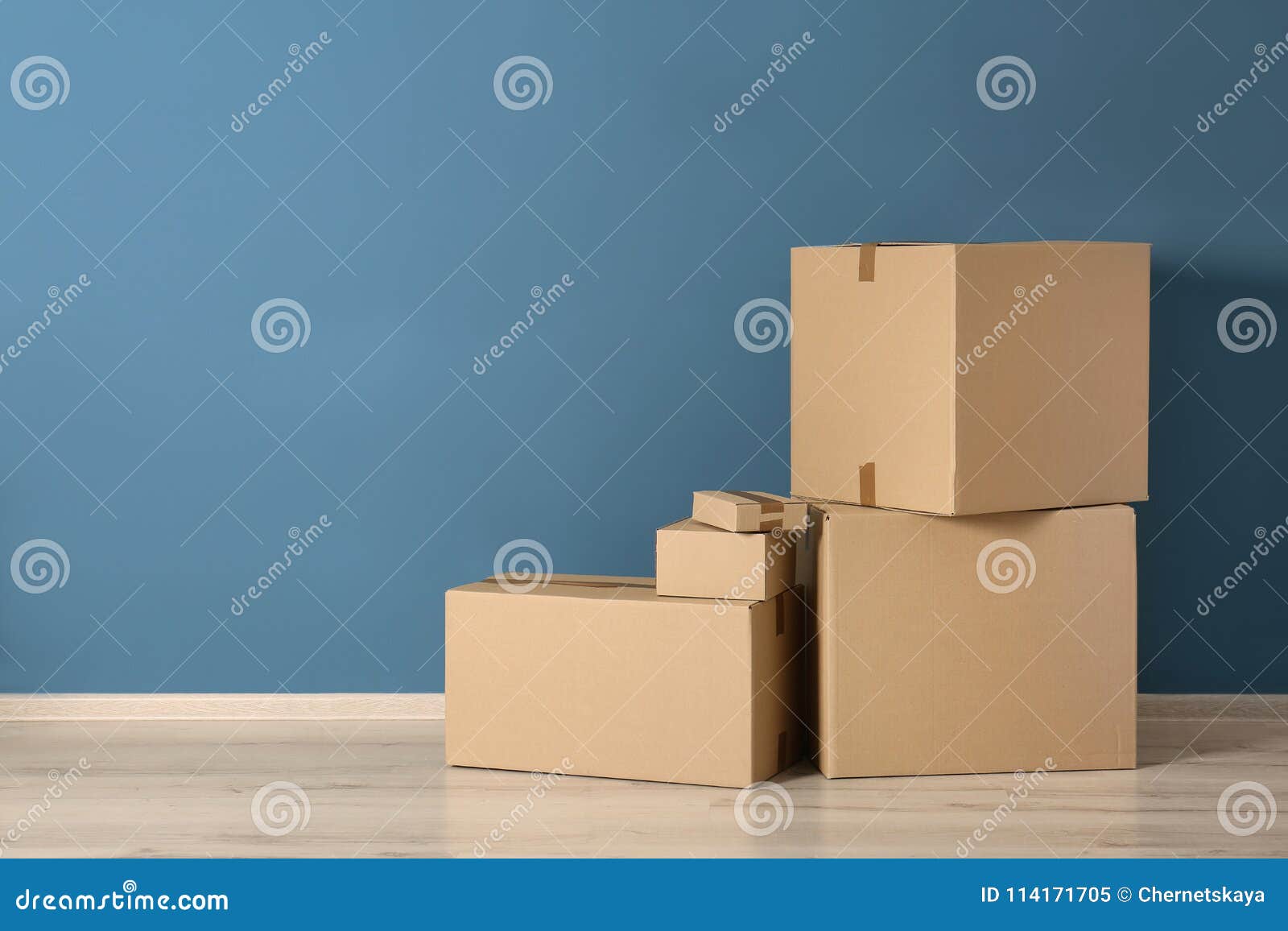 Cardboard boxes near wall stock image. Image of post - 114171705