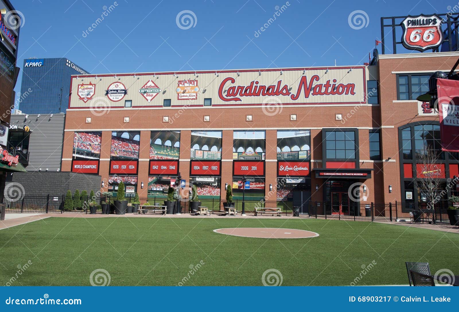 St. Louis Cardinals neon sign with downtown from Busch Stadium