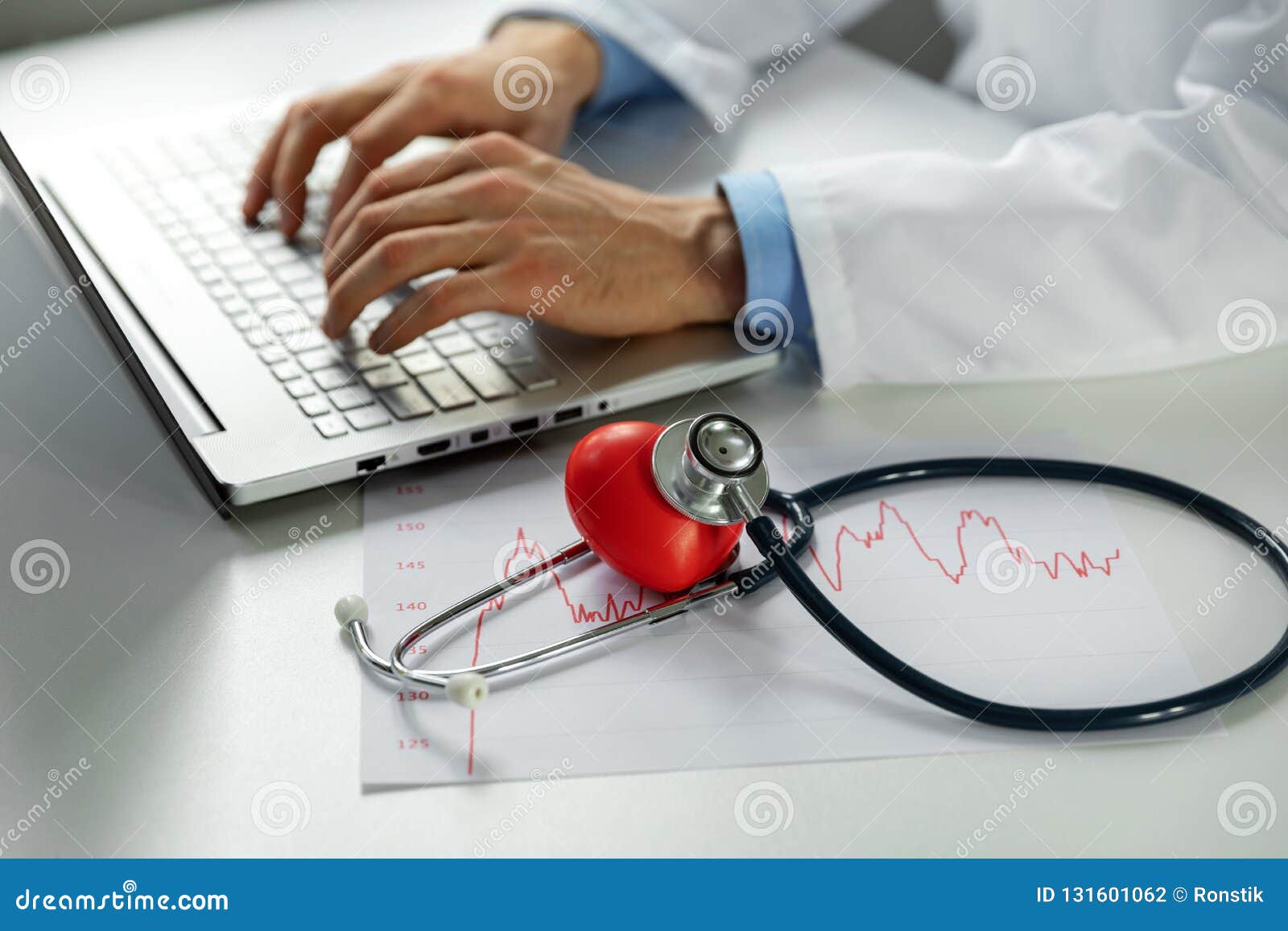 cardiology - doctor cardiologist working on laptop in office