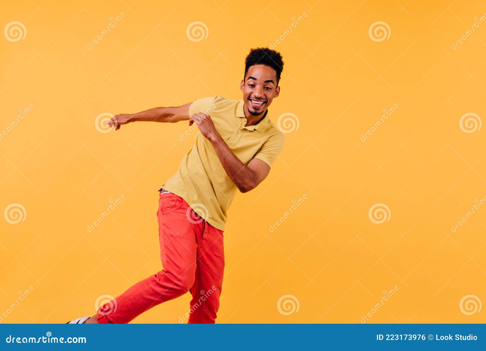 Carefree African Guy Dancing with Excitement. Studio Portrait of ...