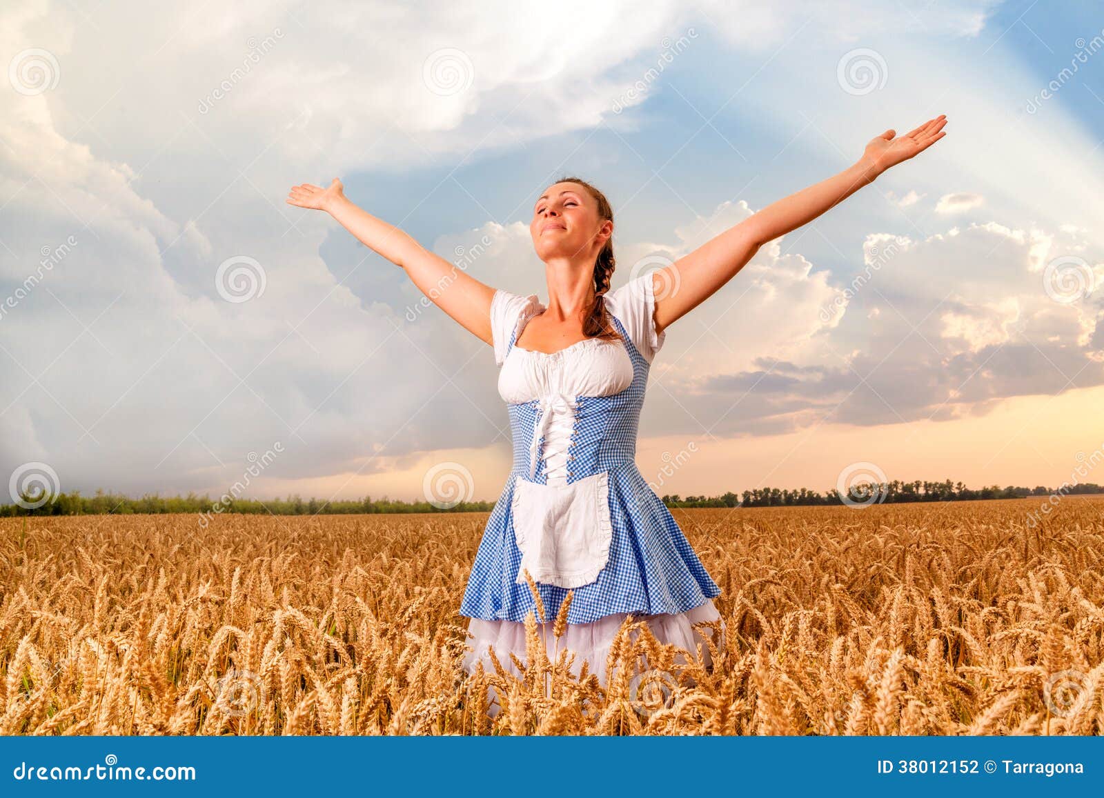 Carefree landscape. Happy female beergarden dirndl wearing girl
