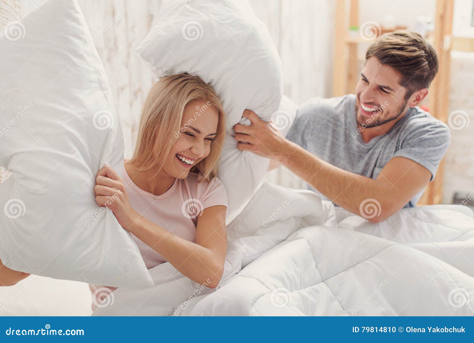 Carefree Loving Couple Having Fun With Cushions Stock Photo Image Of