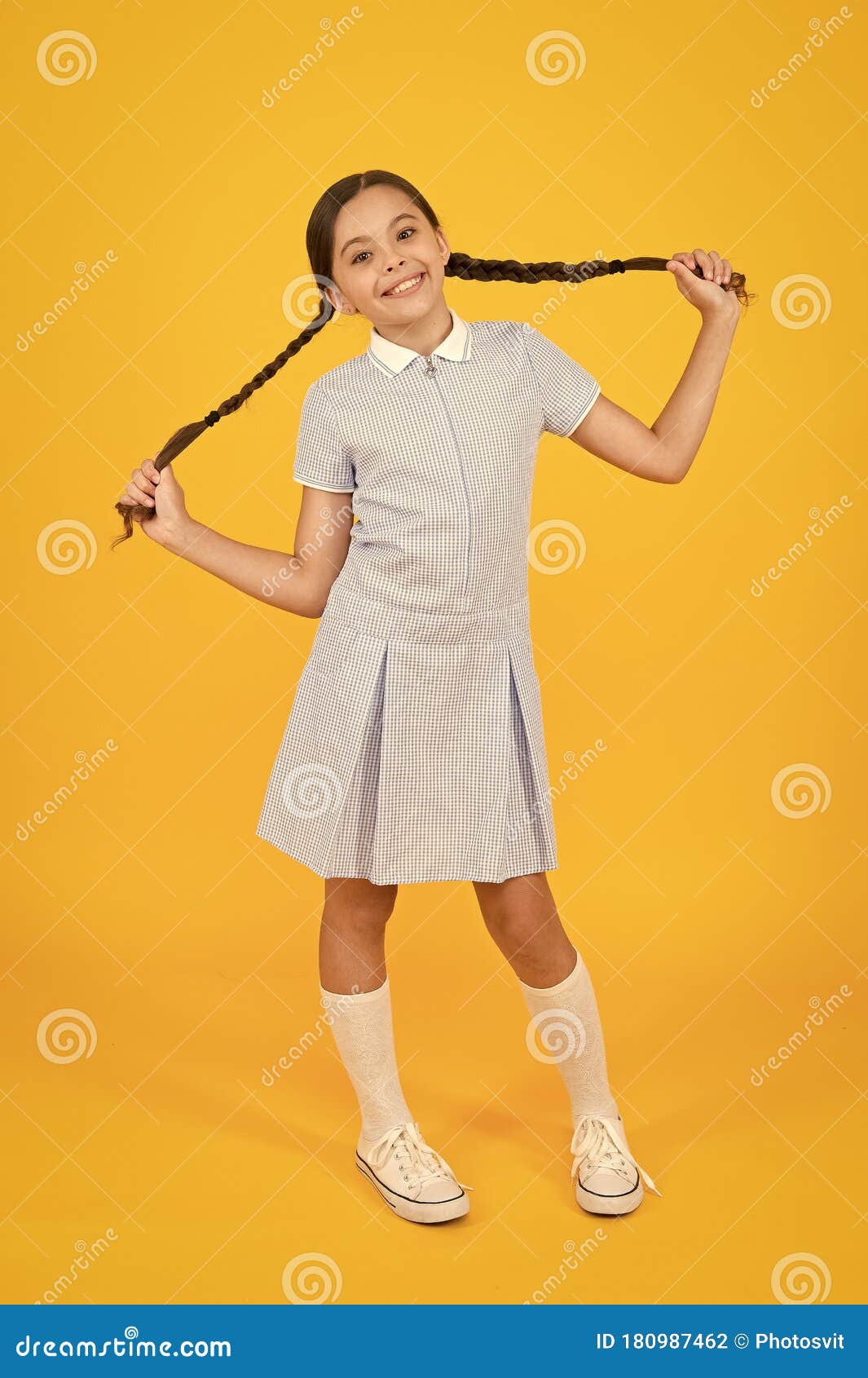 Carefree Pupil. Small Girl In School Uniform. Retro Look. Child In