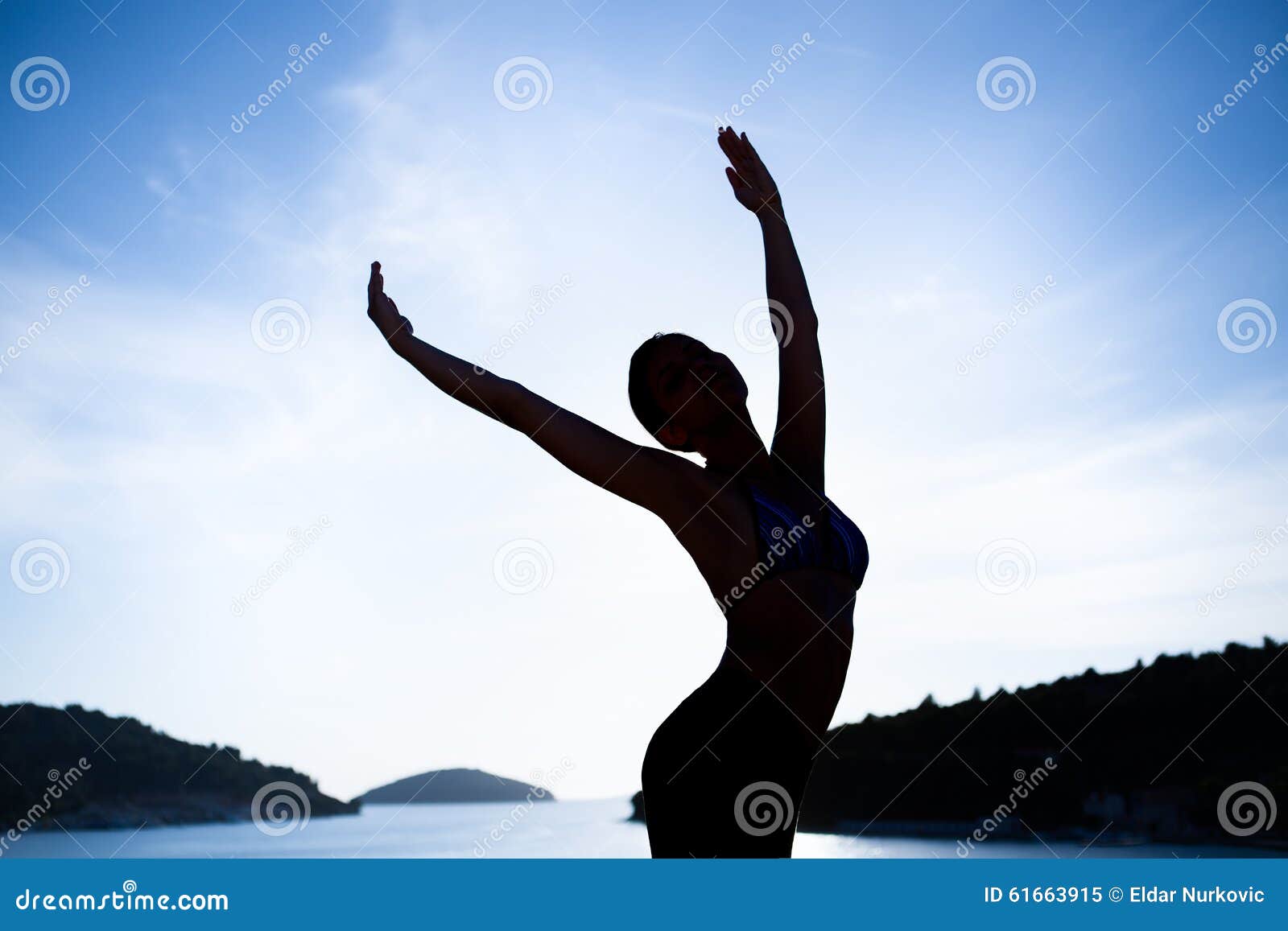 carefree woman dancing.vacation vitality healthy living.free woman embracing the sunshine,enjoying peace,serenity in nature.beauti