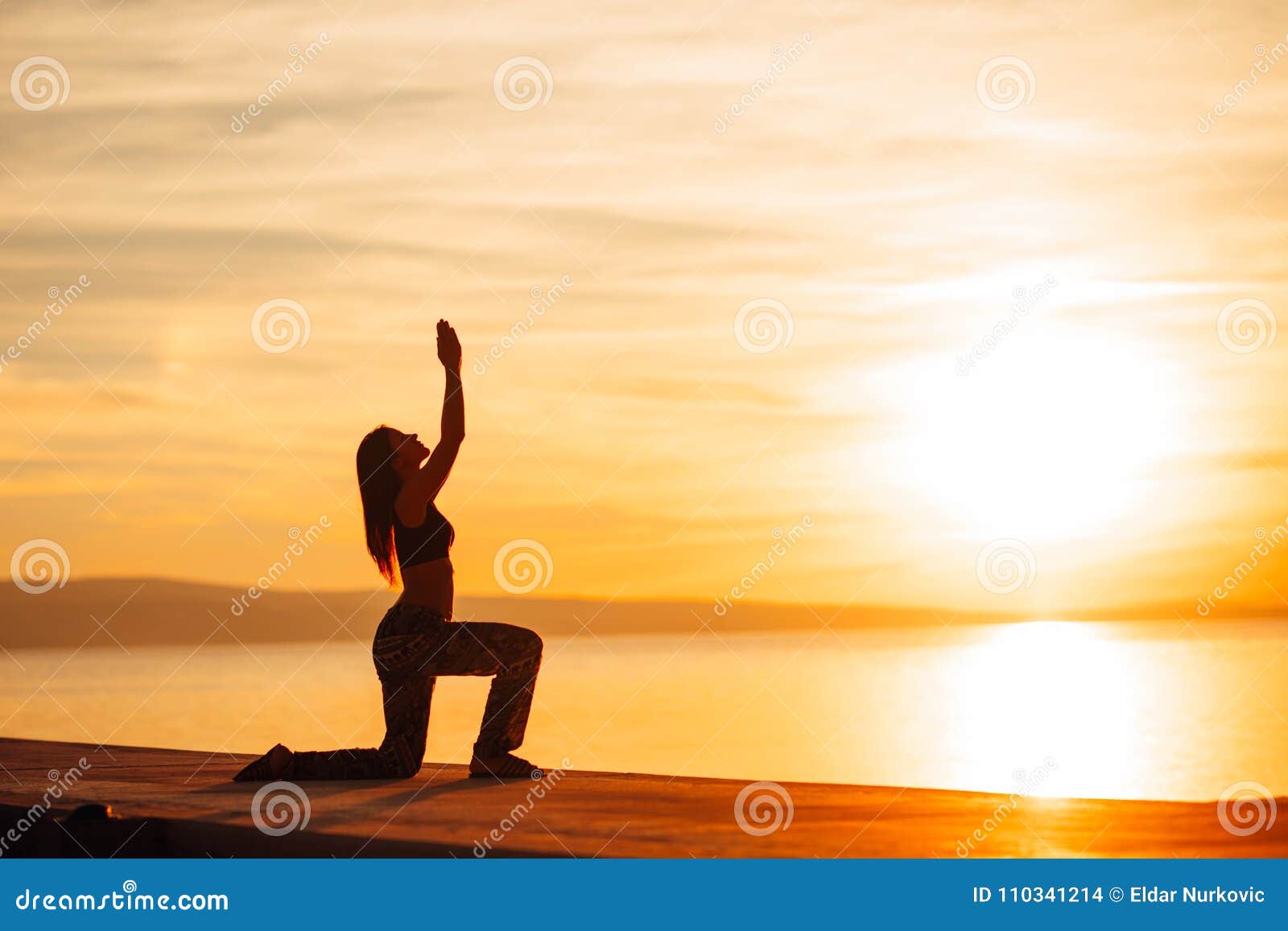 carefree woman meditating in nature.finding inner peace.yoga practice.spiritual healing lifestyle.enjoying peace,anti-stress