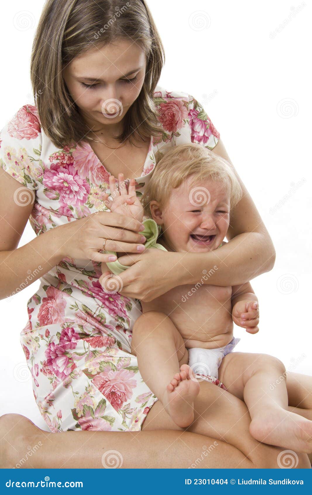 careful mother dresses the daughter