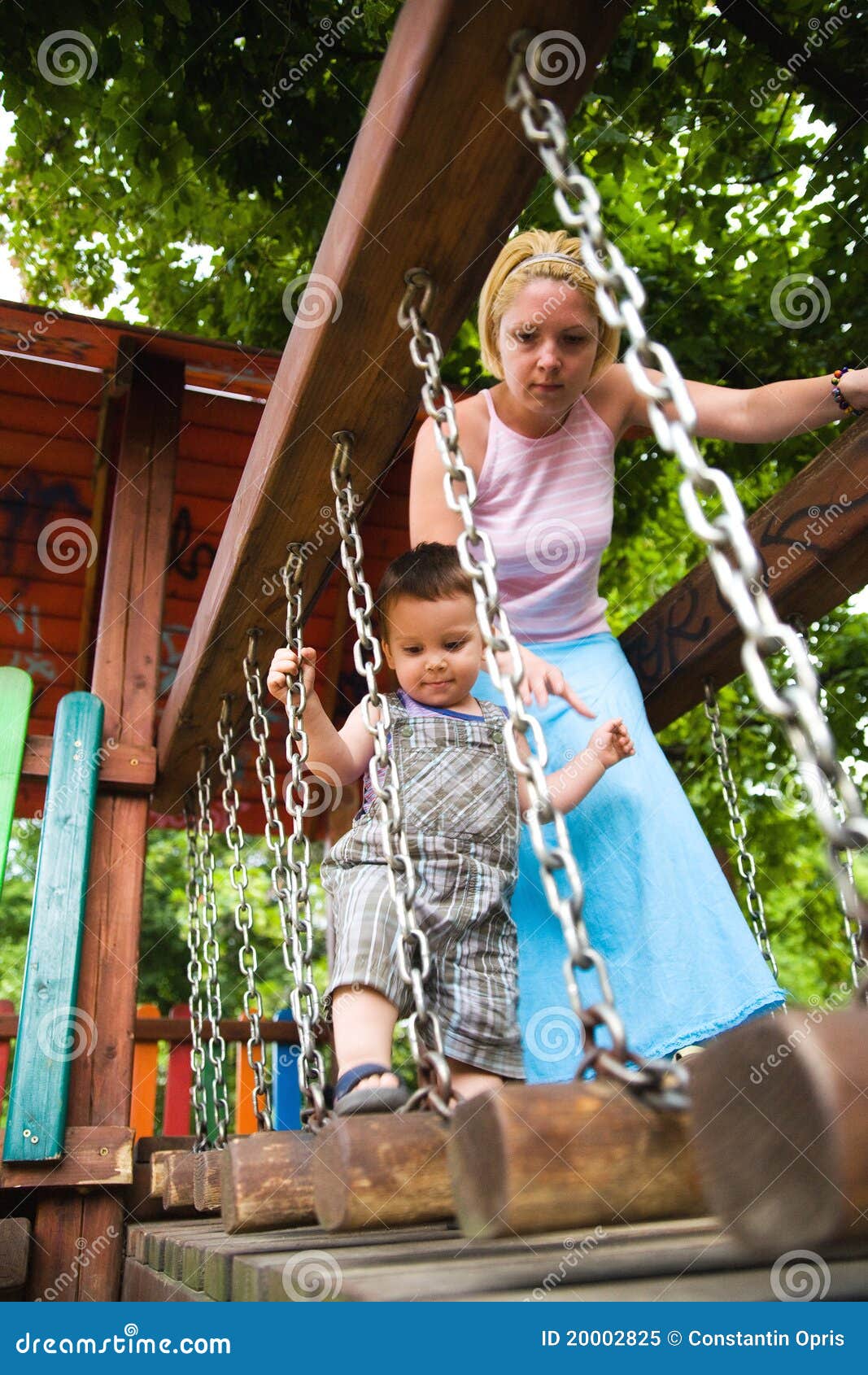 careful mother helping son