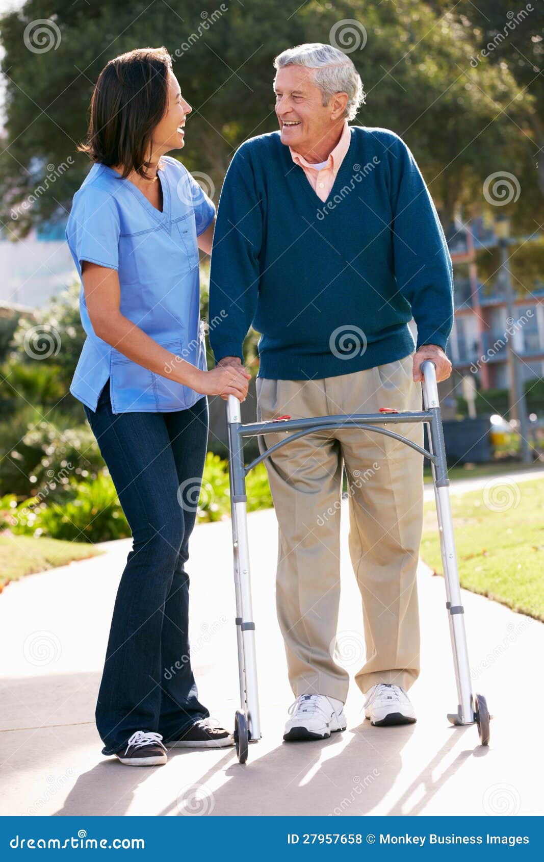 Carer Helping Senior Man With Walking Frame Royalty Free Stock Photos