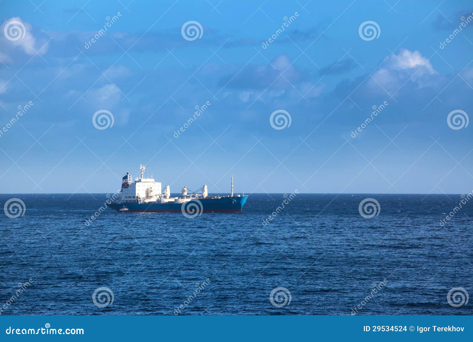 Cargo ship in the ocean stock photo. Image of seascape 29534524