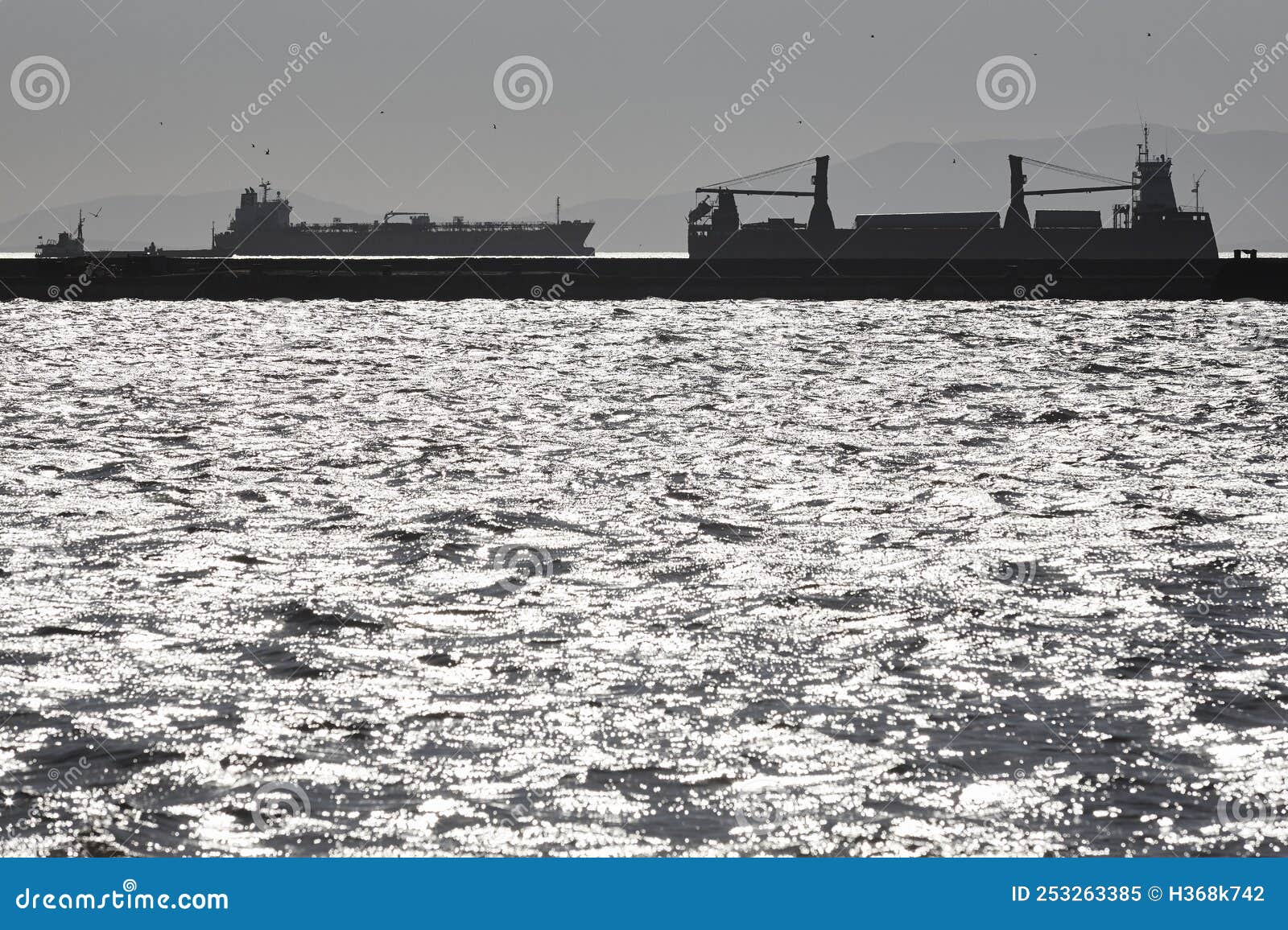 cargo ships at sunset in the aegean sea. esmirna, turkey