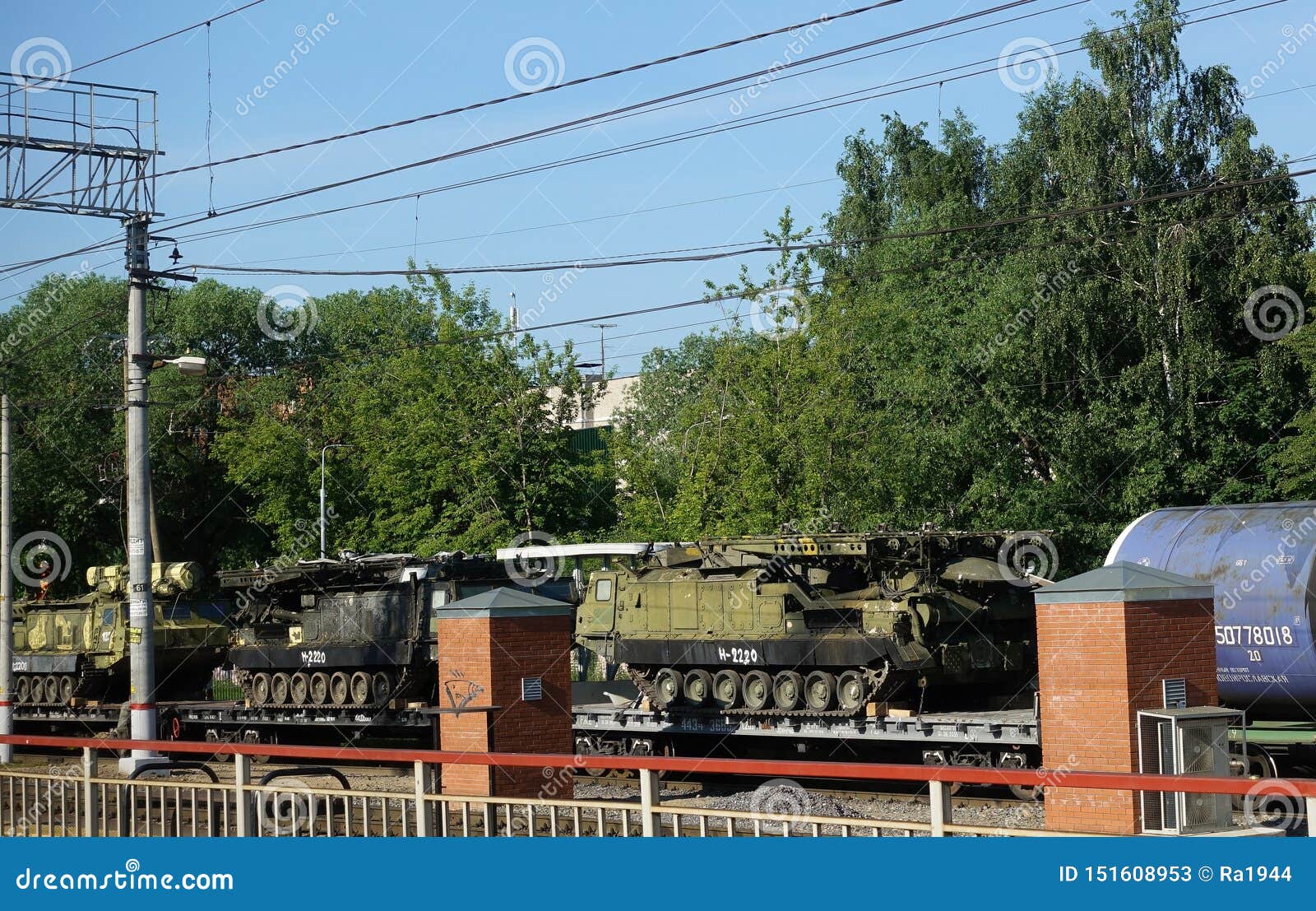 Cargo Train Carrying Military Equipment and Military Armed Tanks on a