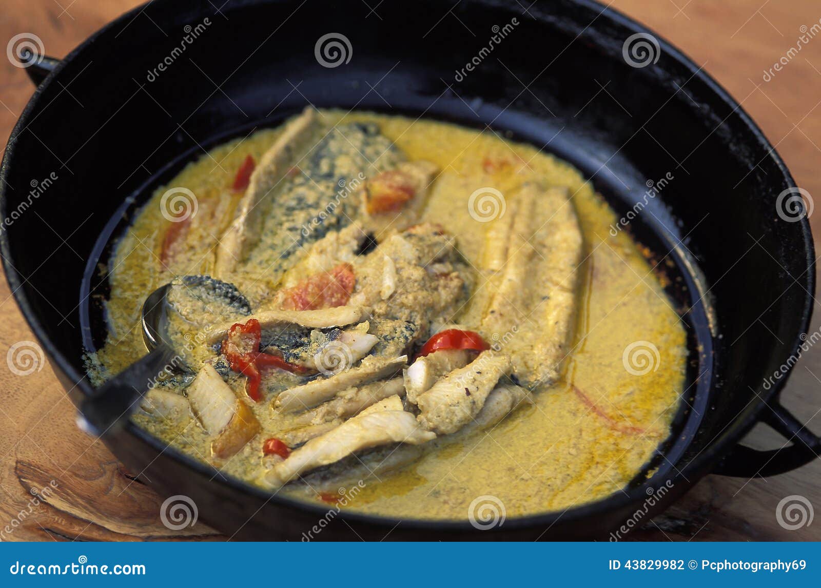 Caribbean food: grilled fish with coconut. Caribbean food: fish and coconut stew. Tobago, West Indies.