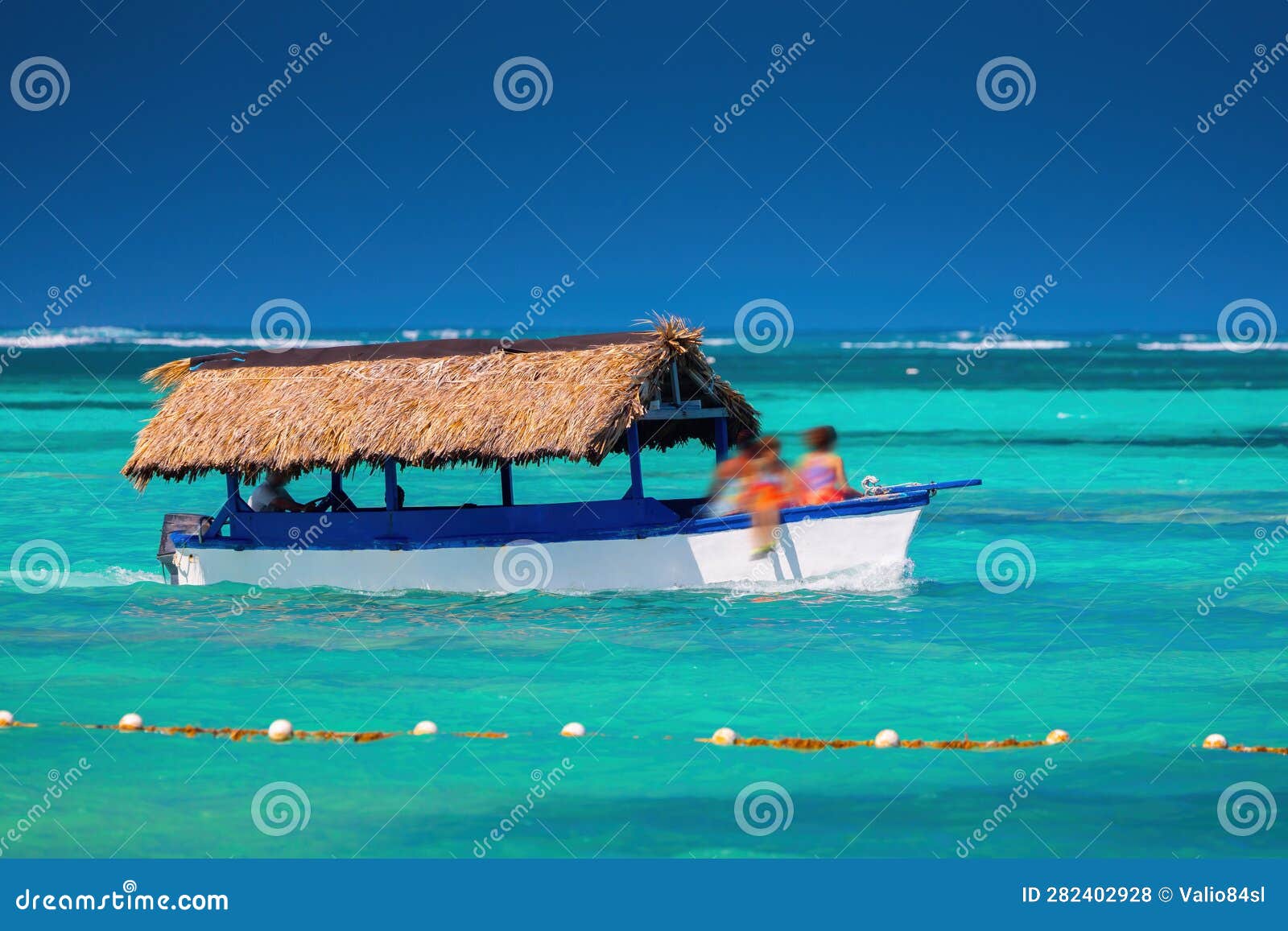 caribbean sea and sailing boat on the water, hot summer day on the caribe. punta cana, dominican republic