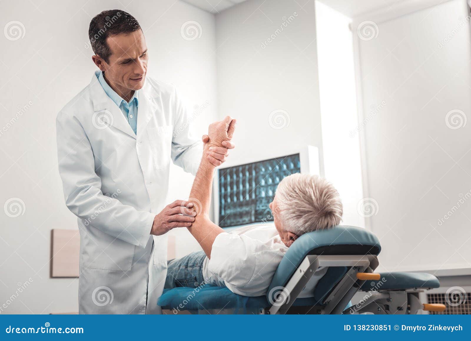 caring-skillful-chiropractor-examining-h