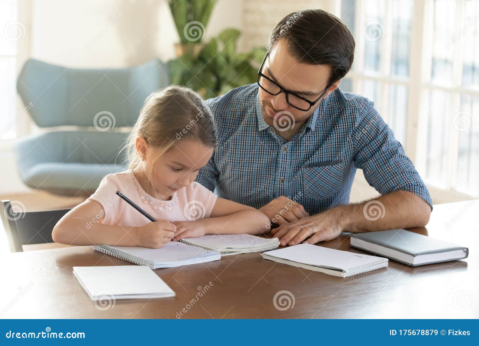 dad helping kid with homework