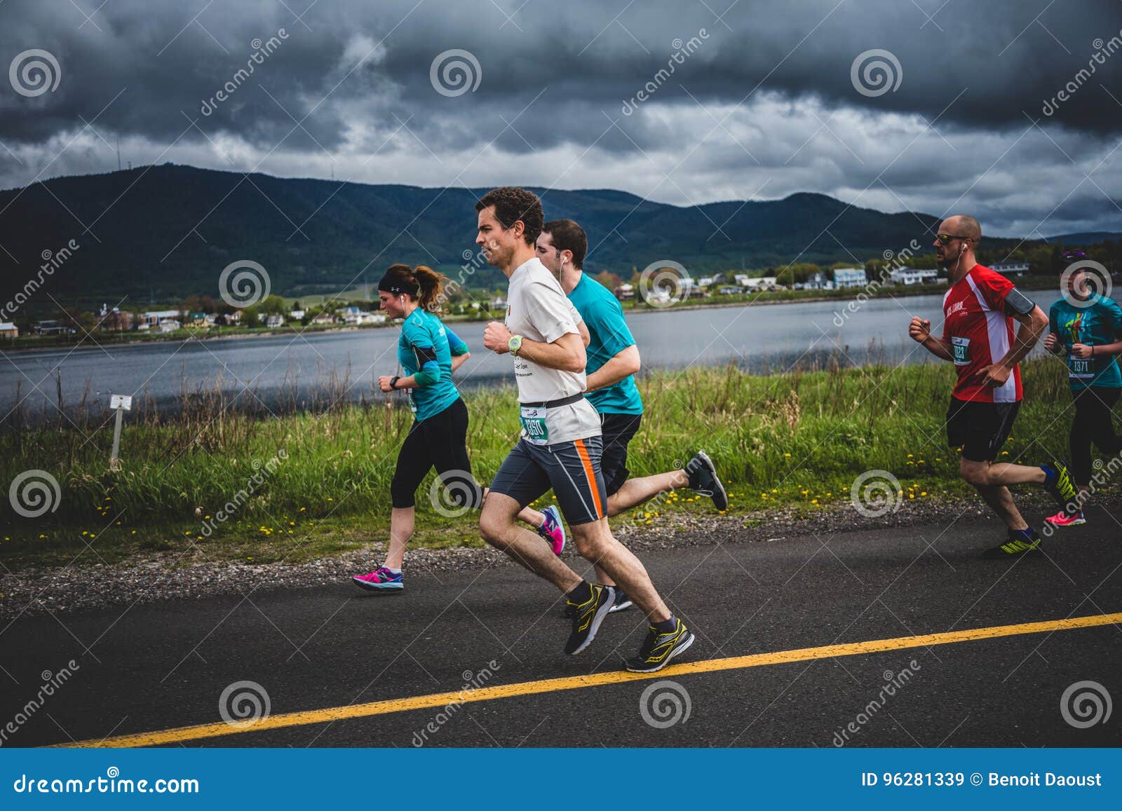 Group of 10K Runners in Front of a Beautiful Mountain Landscape