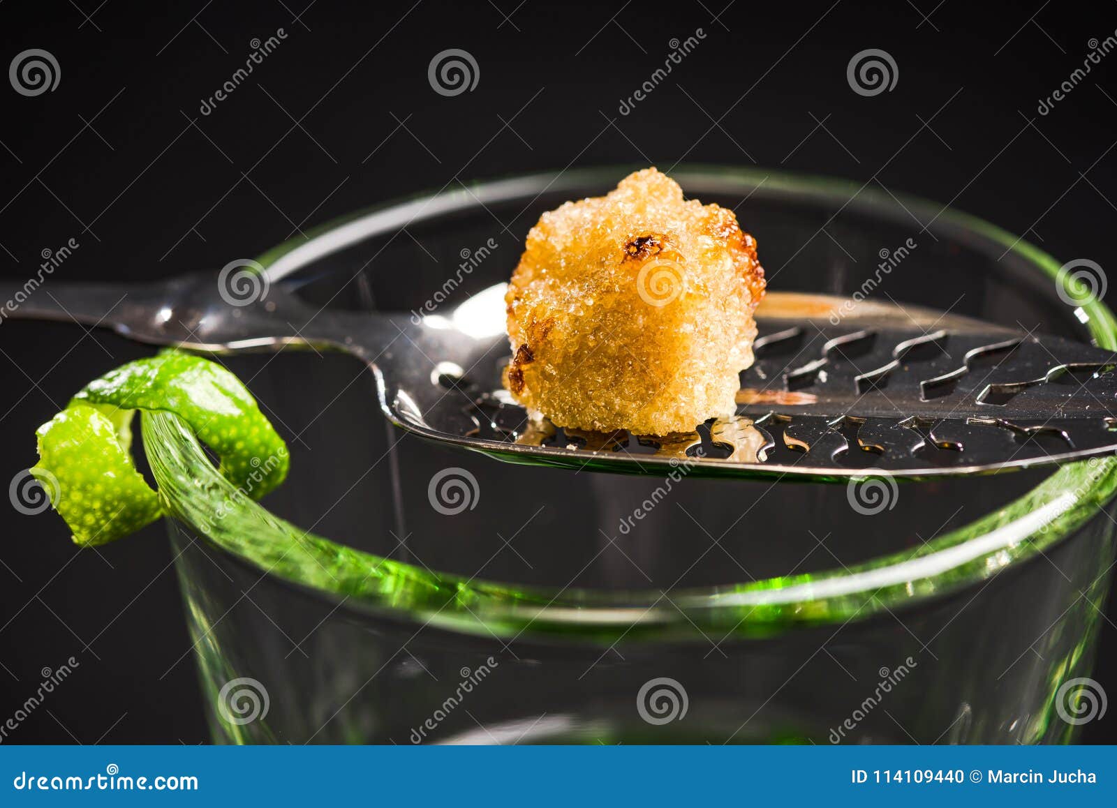 Carmelized Sugar Cube Over Green Absinthe Vodka Stock Photo Image of