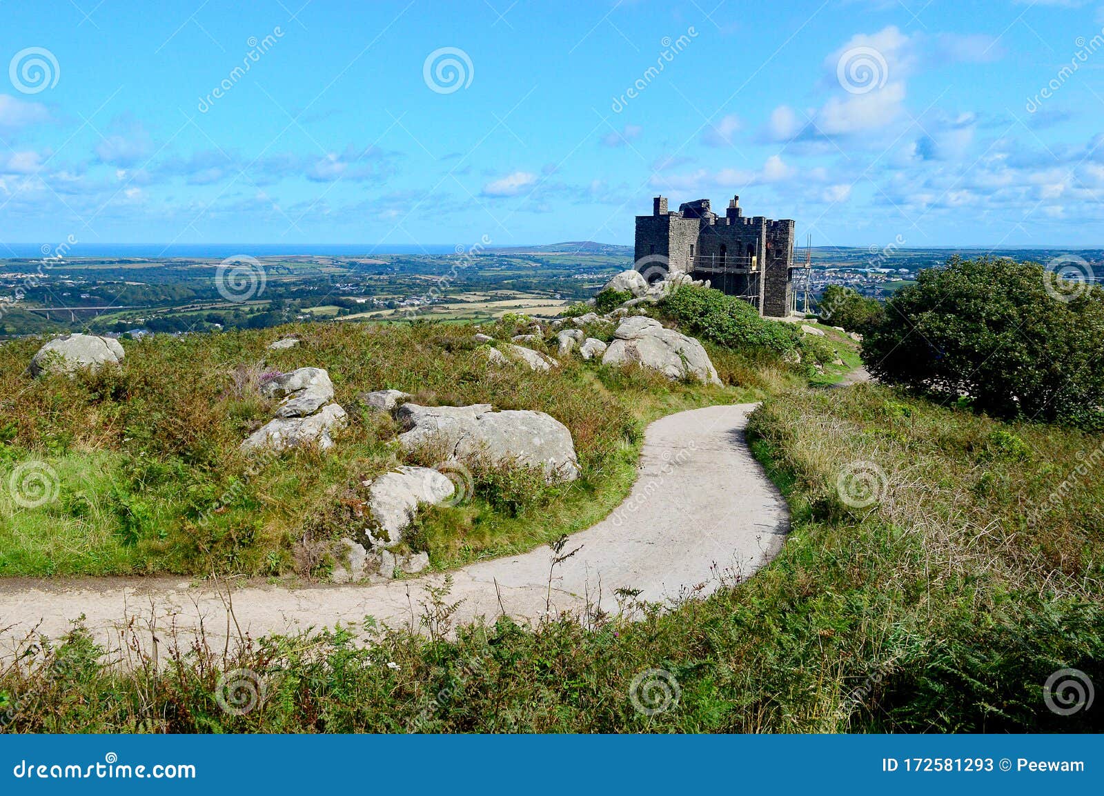 view over carn brea castle and redruth towards st agnes head from carn brea, cornwall