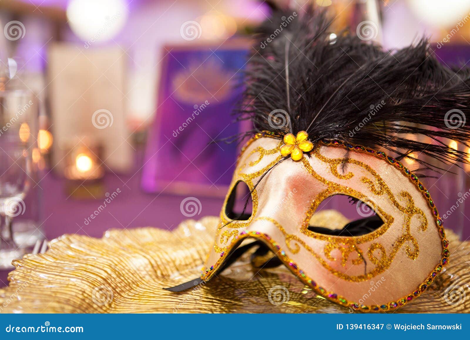 carnaval table with venetian mask on the plate