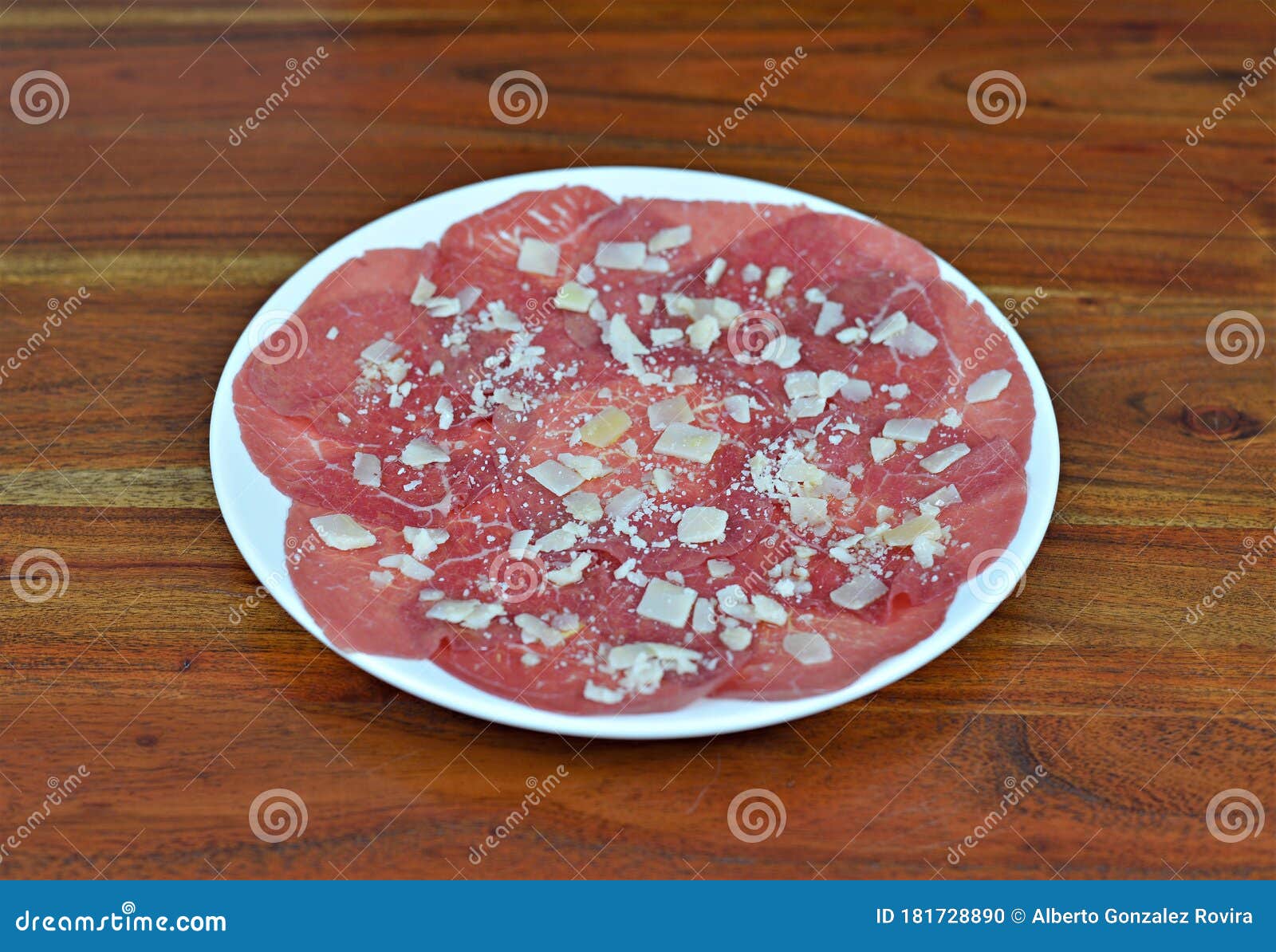 carpaccio beef dish with parmesan cheese