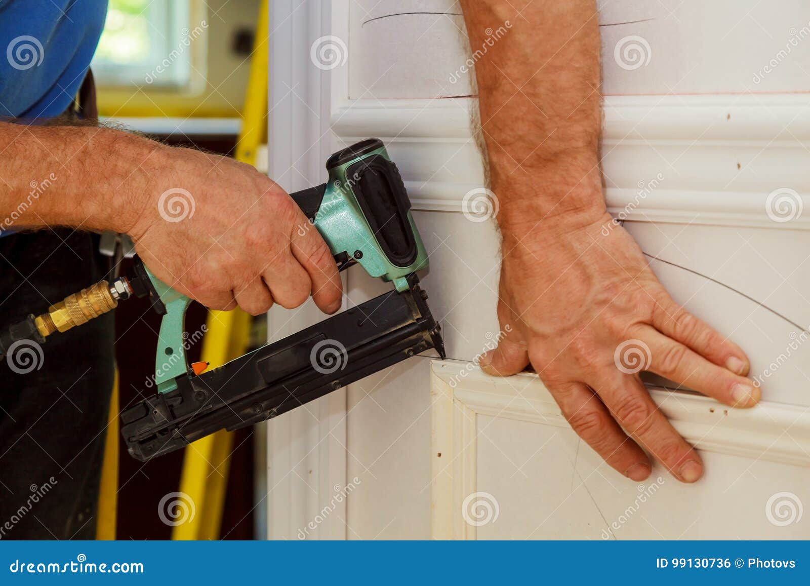 Carpenter Brad Using Nail Gun To Moulding Stock Photo Image of industrial, improvement 99130736