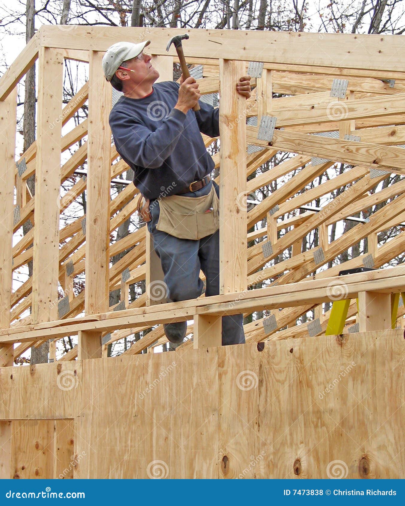 carpenter framing gable end of house