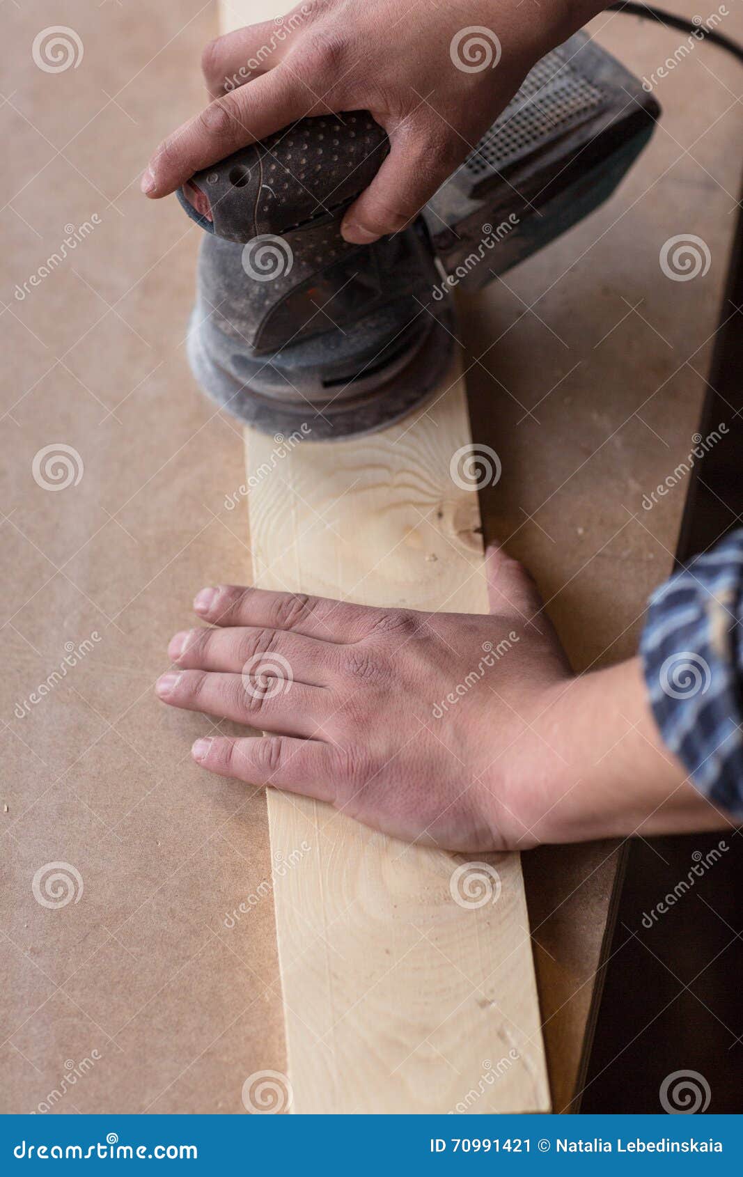 Carpenter Hands Using Electric Sander. Carpenter Sanding A Wood Stock