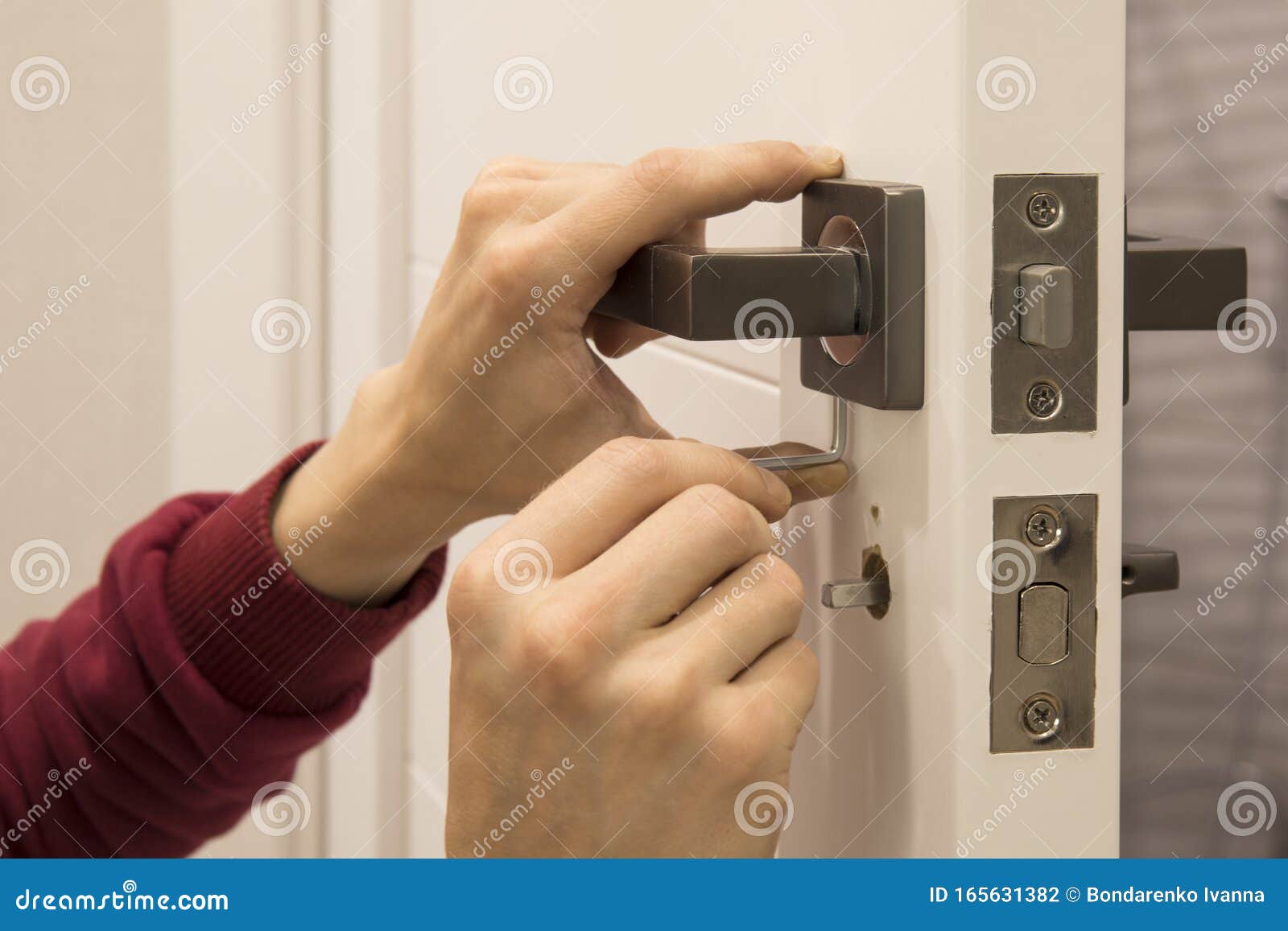 Carpenter Installing the Lock on the Door Installation of the Door Lock