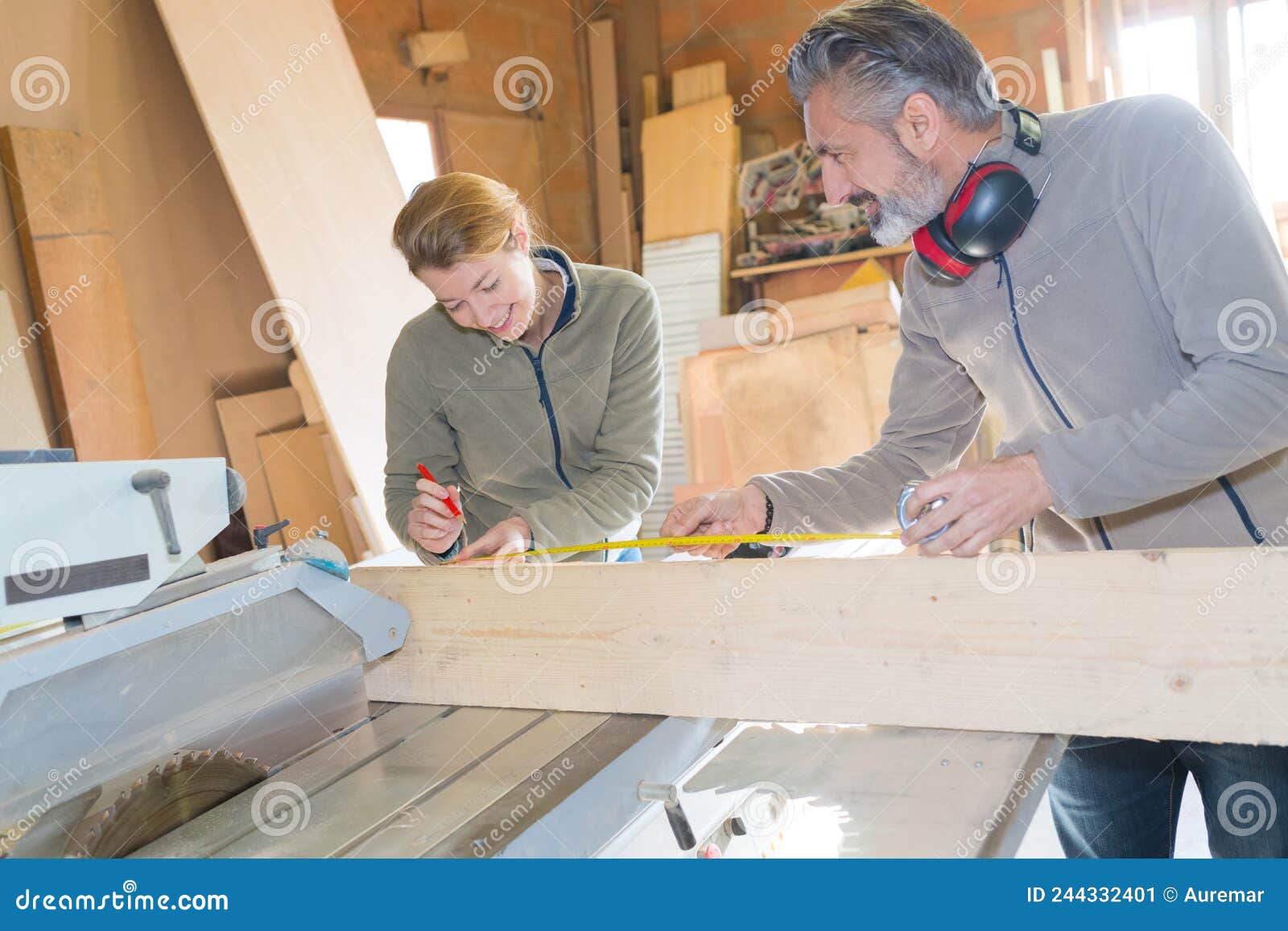 Carpenter Learning during Measuring Apprenticeships Lesson Stock Image