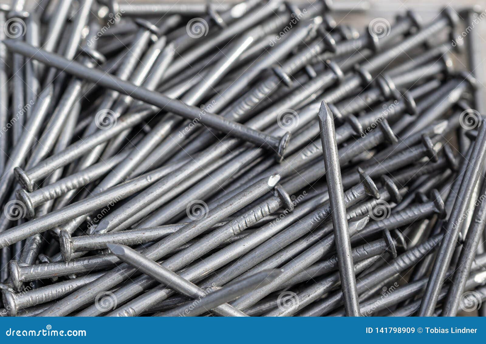 Carpenter nails in a box stock image. Image of steel - 141798909