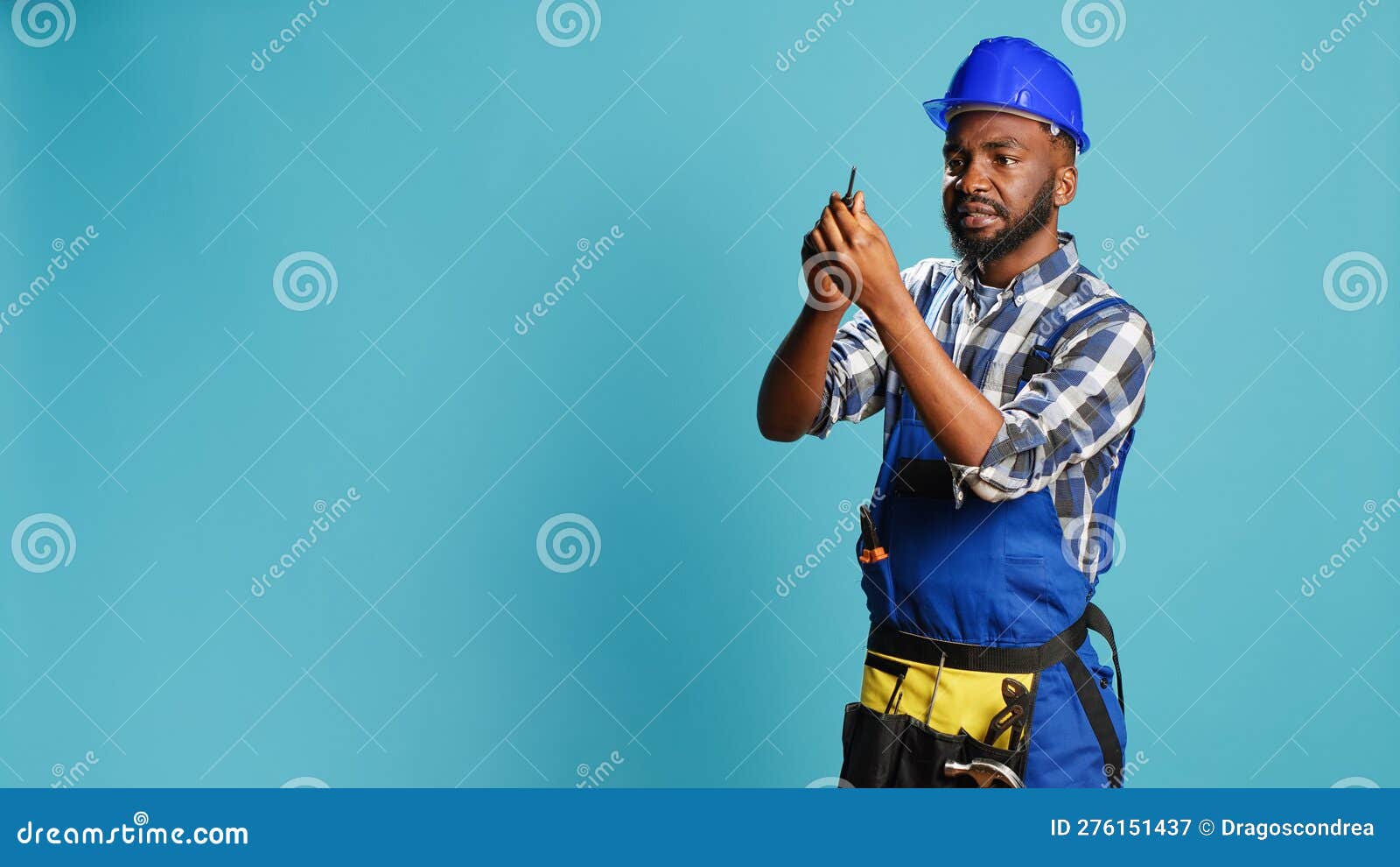 Carpenter in Overalls Holding Screwdriver in Studio Stock Image Image