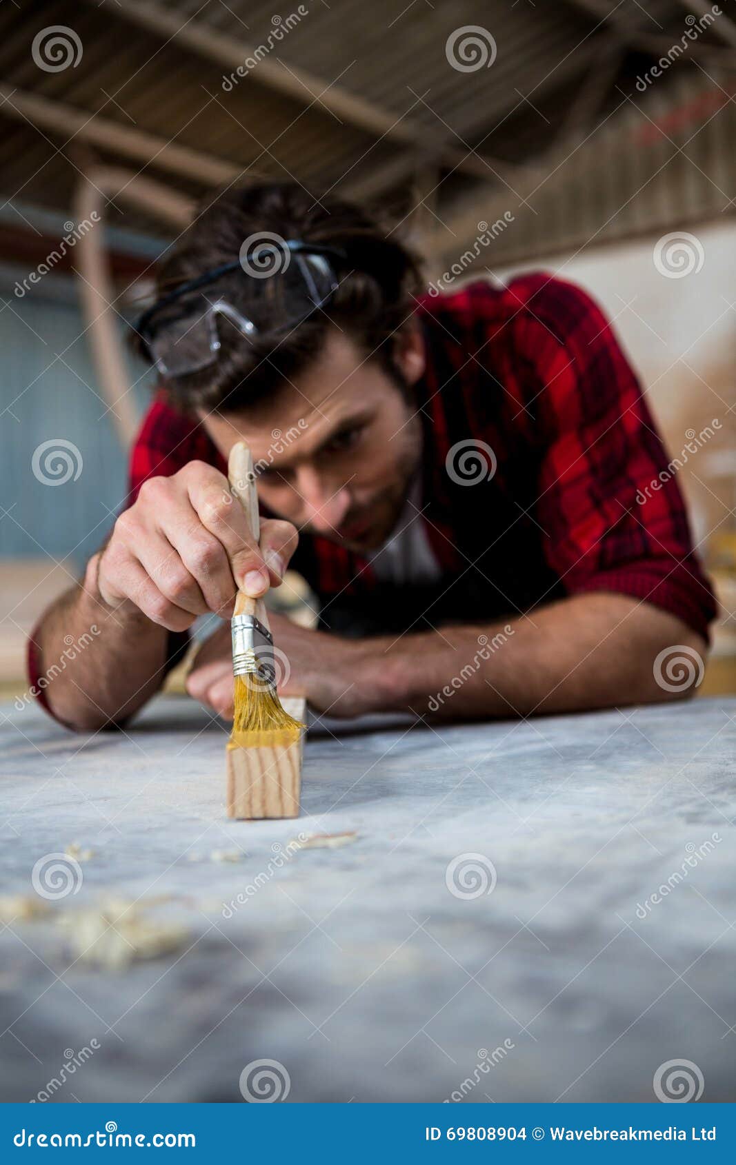 Carpenter Painting a Piece of Wood Stock Photo Image of painting